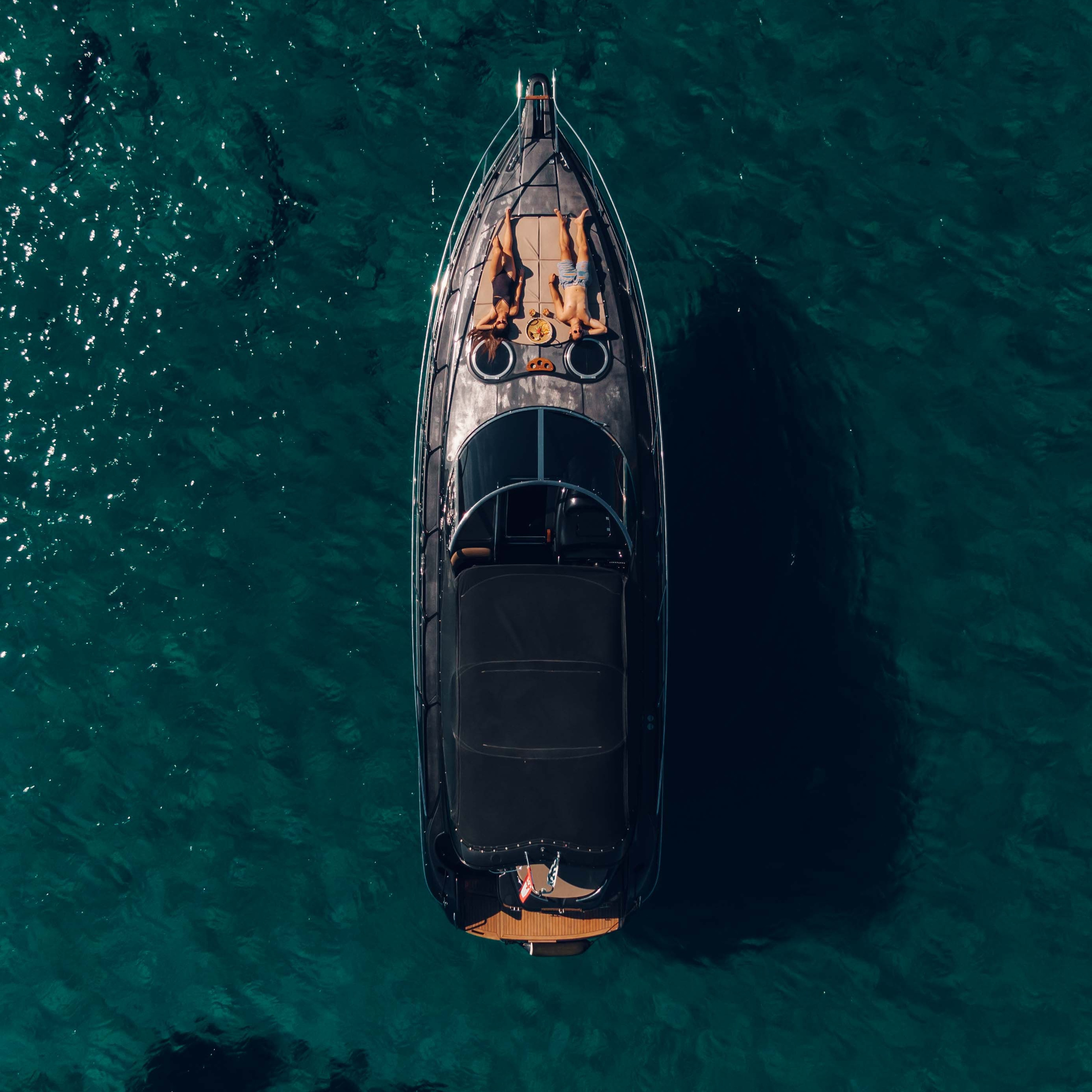 Luxury yacht drone and lifestyle photography capturing elegant details and sea experience.