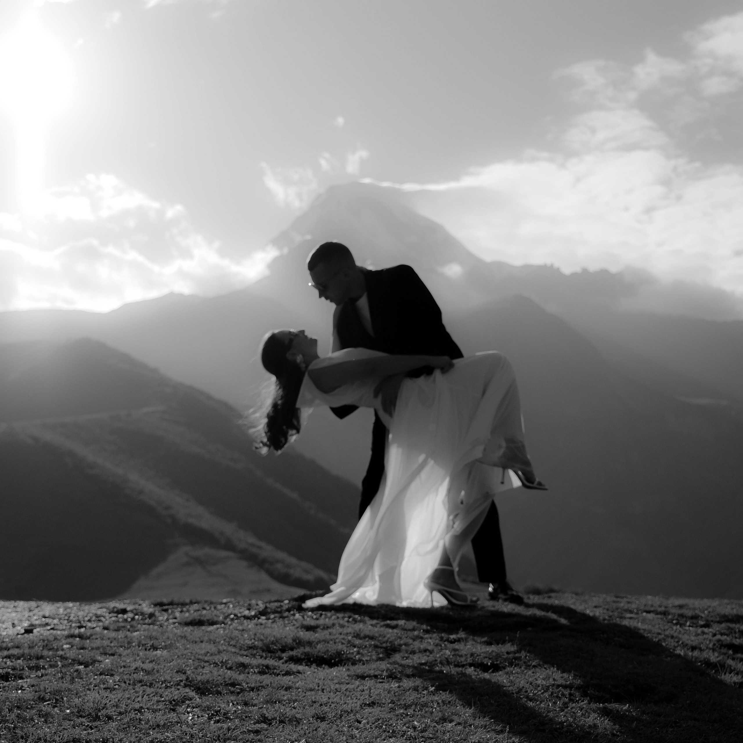 Couple embracing with Caucasus mountains in the background