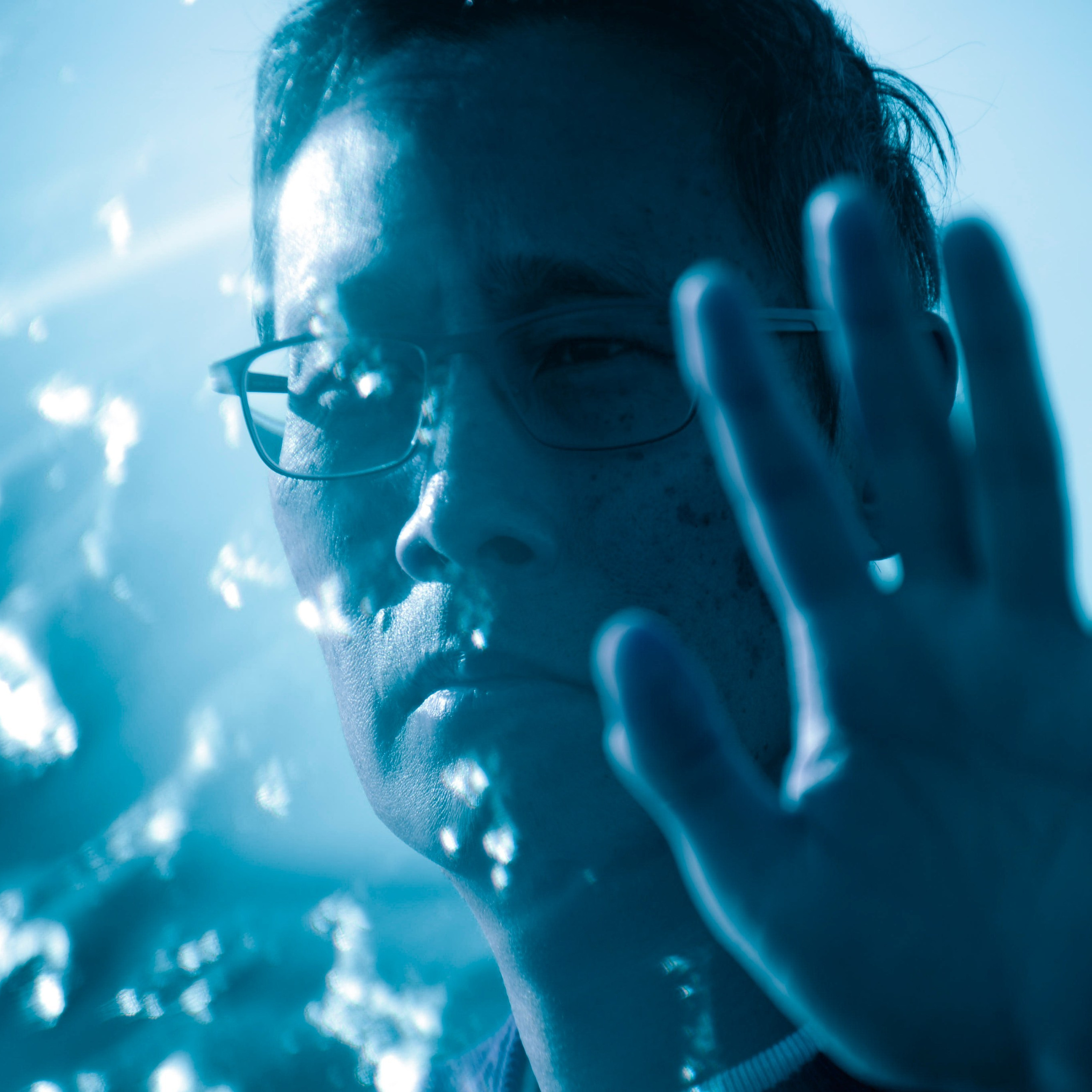 Creative conceptual photographer Birmingham, artistic hands blue light portrait