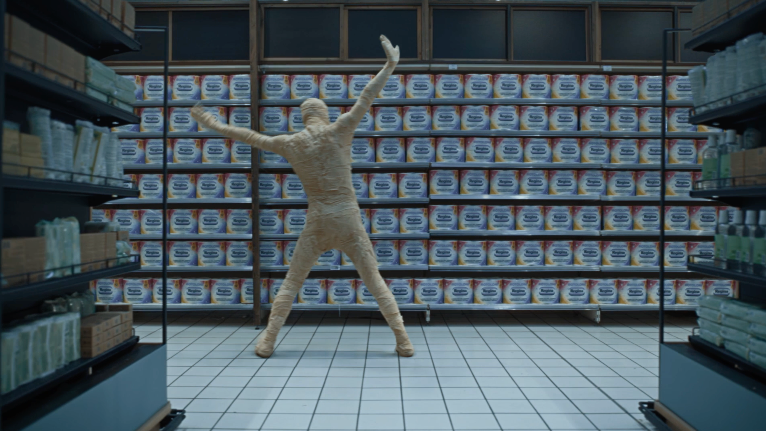 A John Travolta mummy dance-shopping to Bee Gee`s Staying alive for a newer and cleaner wrap.