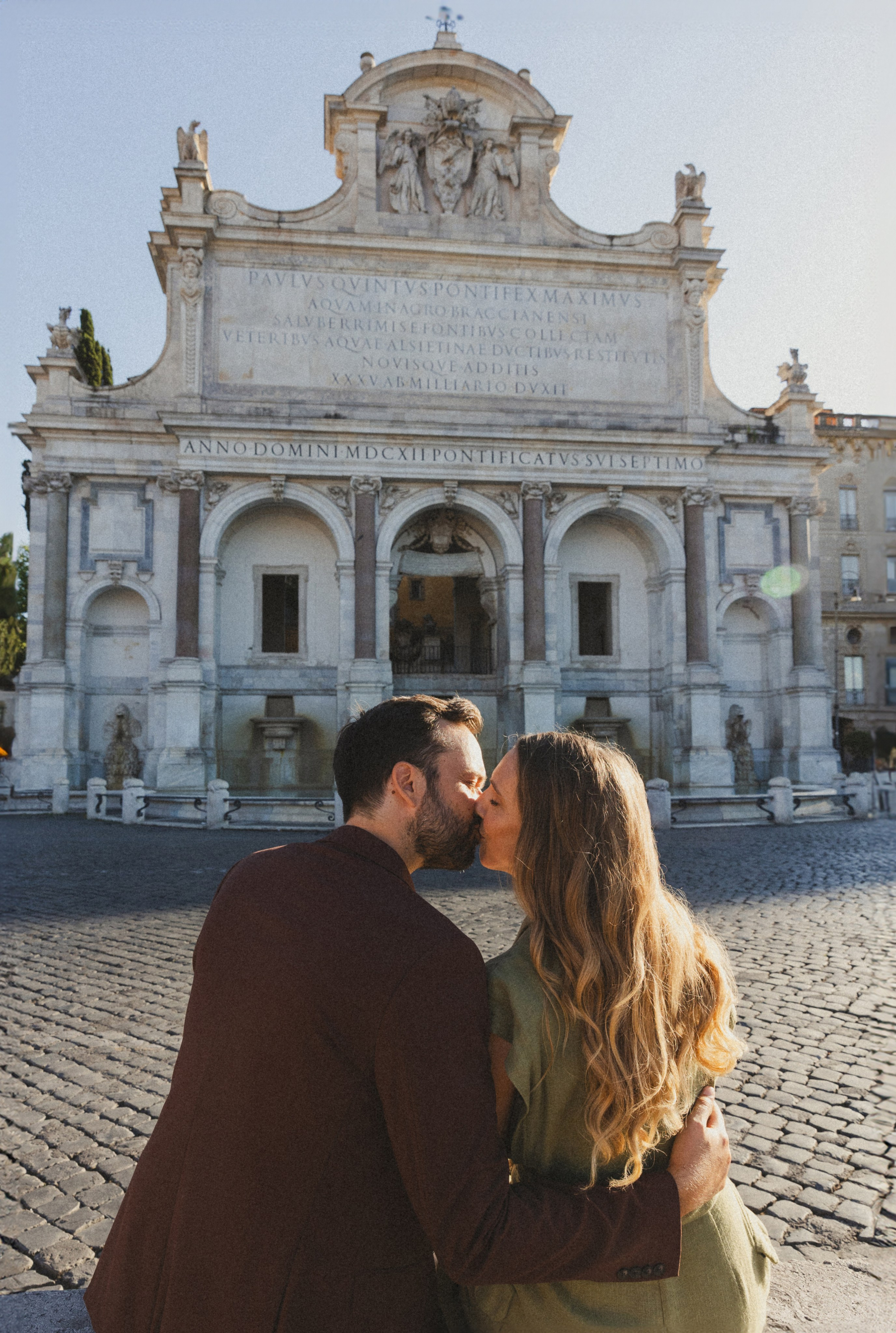 A couple kissing in a picturesque place at Gianicolo Hill in Rome.