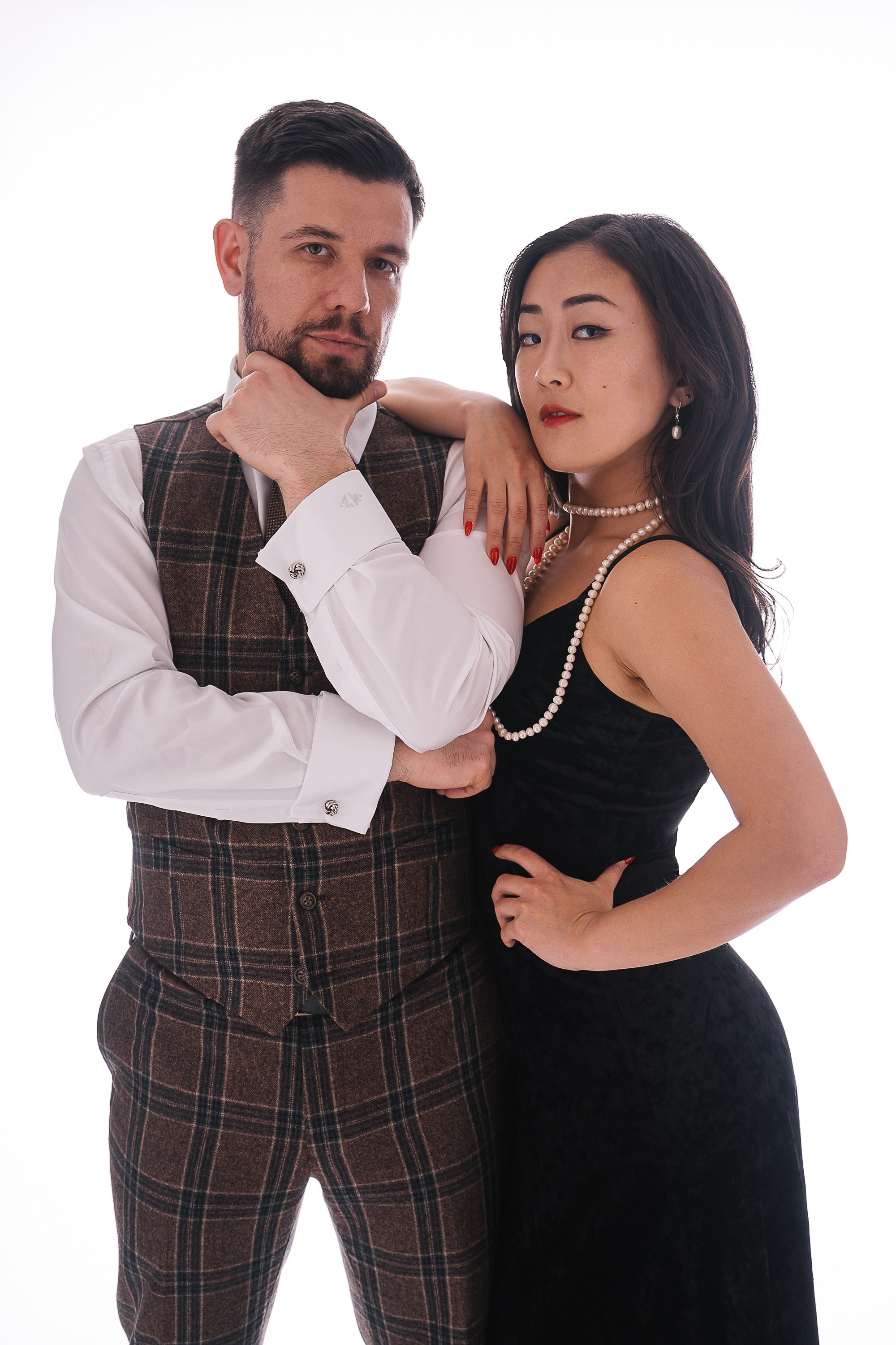 Couple dressed up and ready to go to Gatsby themed party