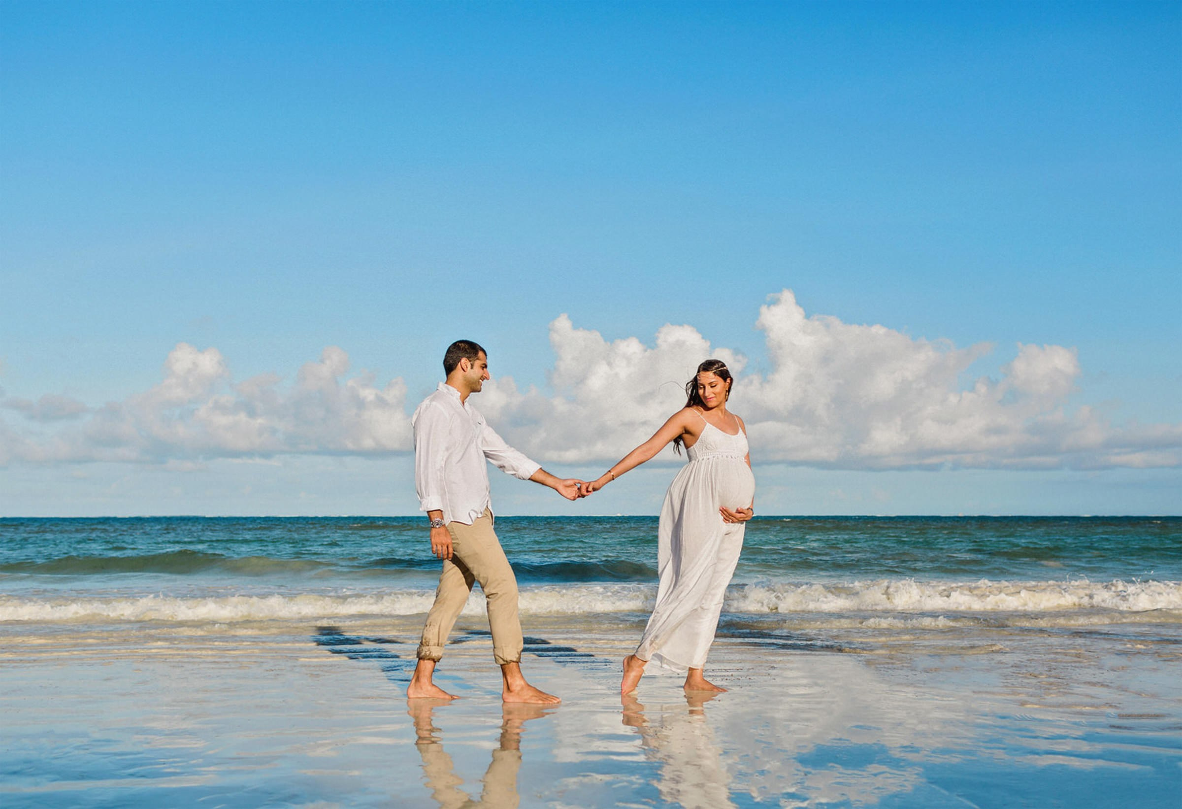Family playing together in the waves along the Kenya Coast—spontaneous laughter and warm light blending perfectly in this joyful beach maternity photography session.