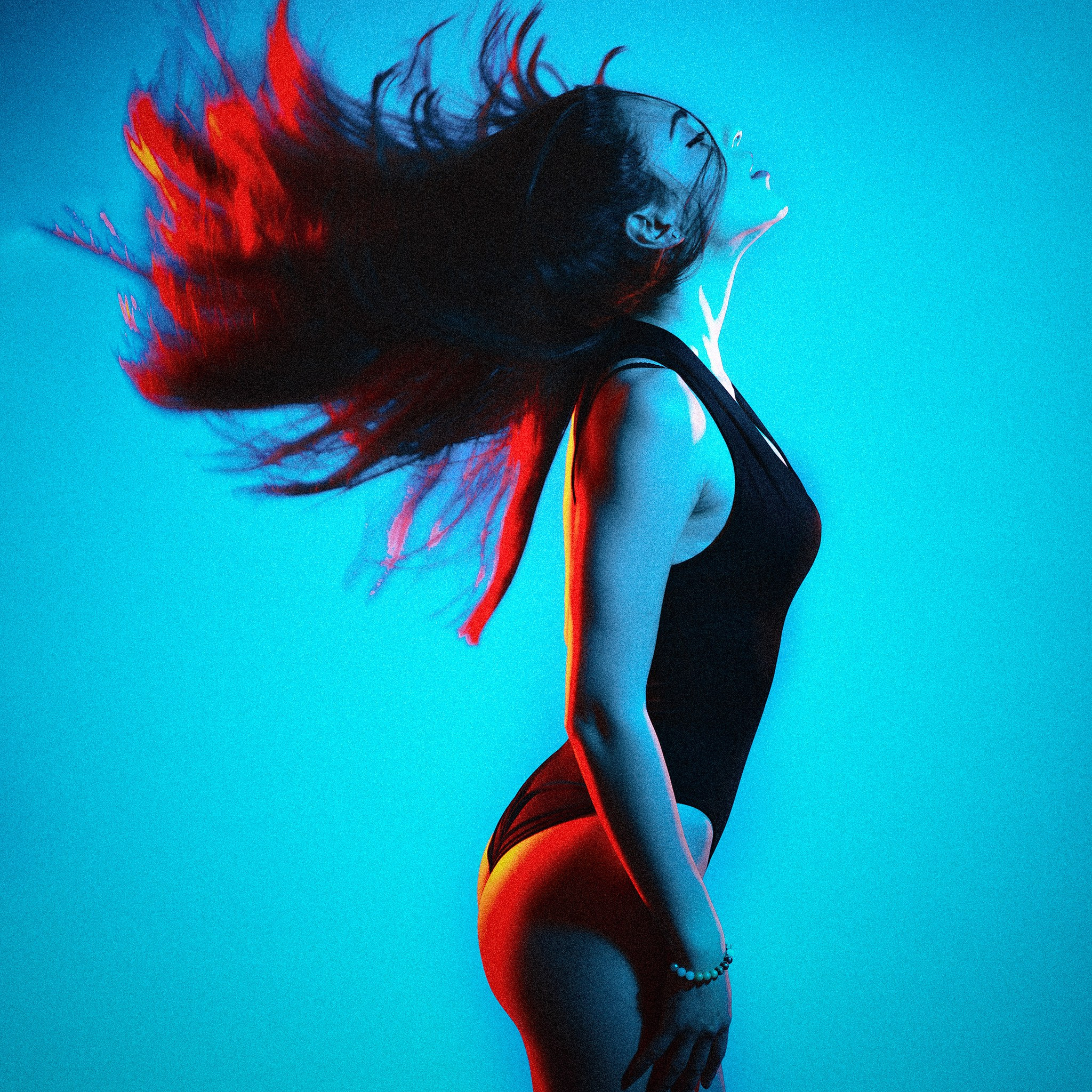 Creative individual portrait session dramatic studio lighting blue background Dimitri Studio