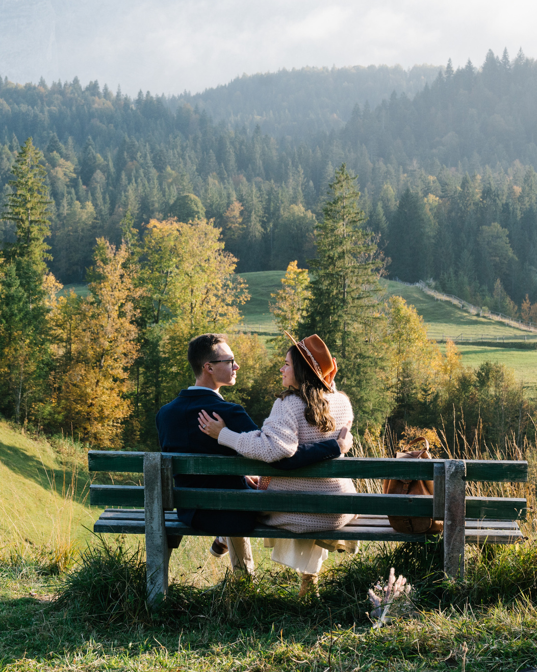 Couple is sitting on the bench with a Mountain View 