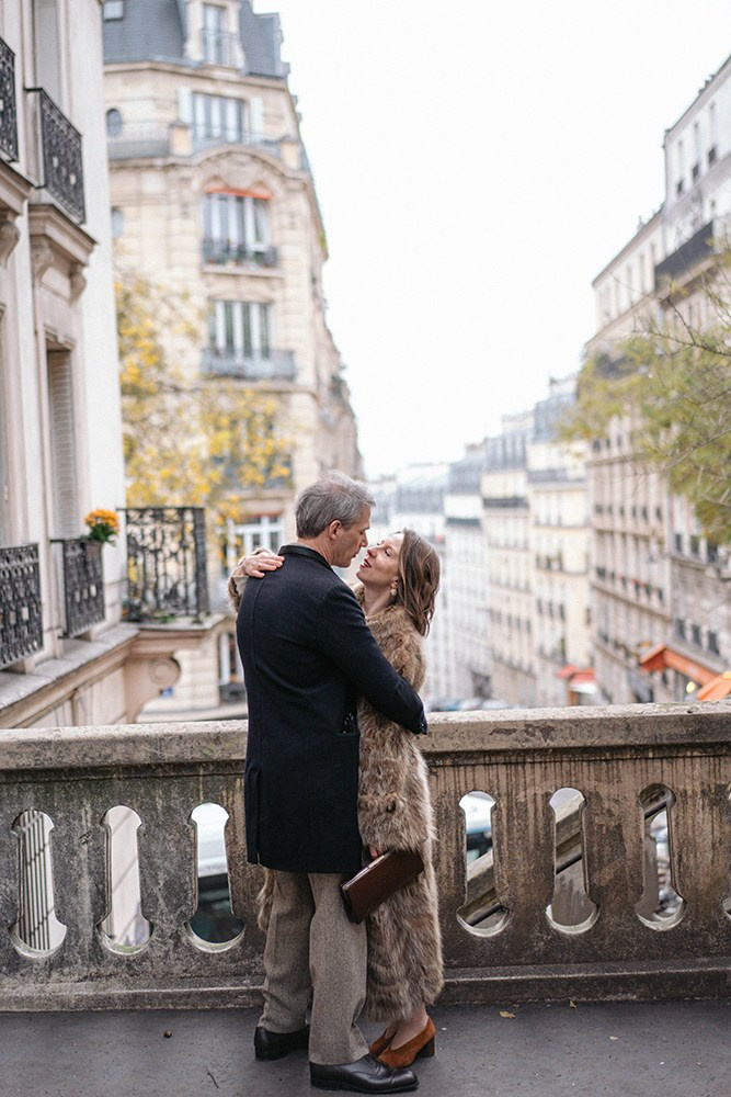 A couple walking through Montmartre during a photoshoot