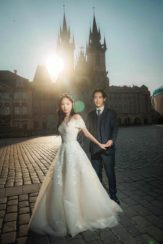 Candid wedding photography — Turkish bride is lifted joyfully by her Czech groom during their wedding celebration at Grand Mark Prague hotel — Kurt Vinion Photography