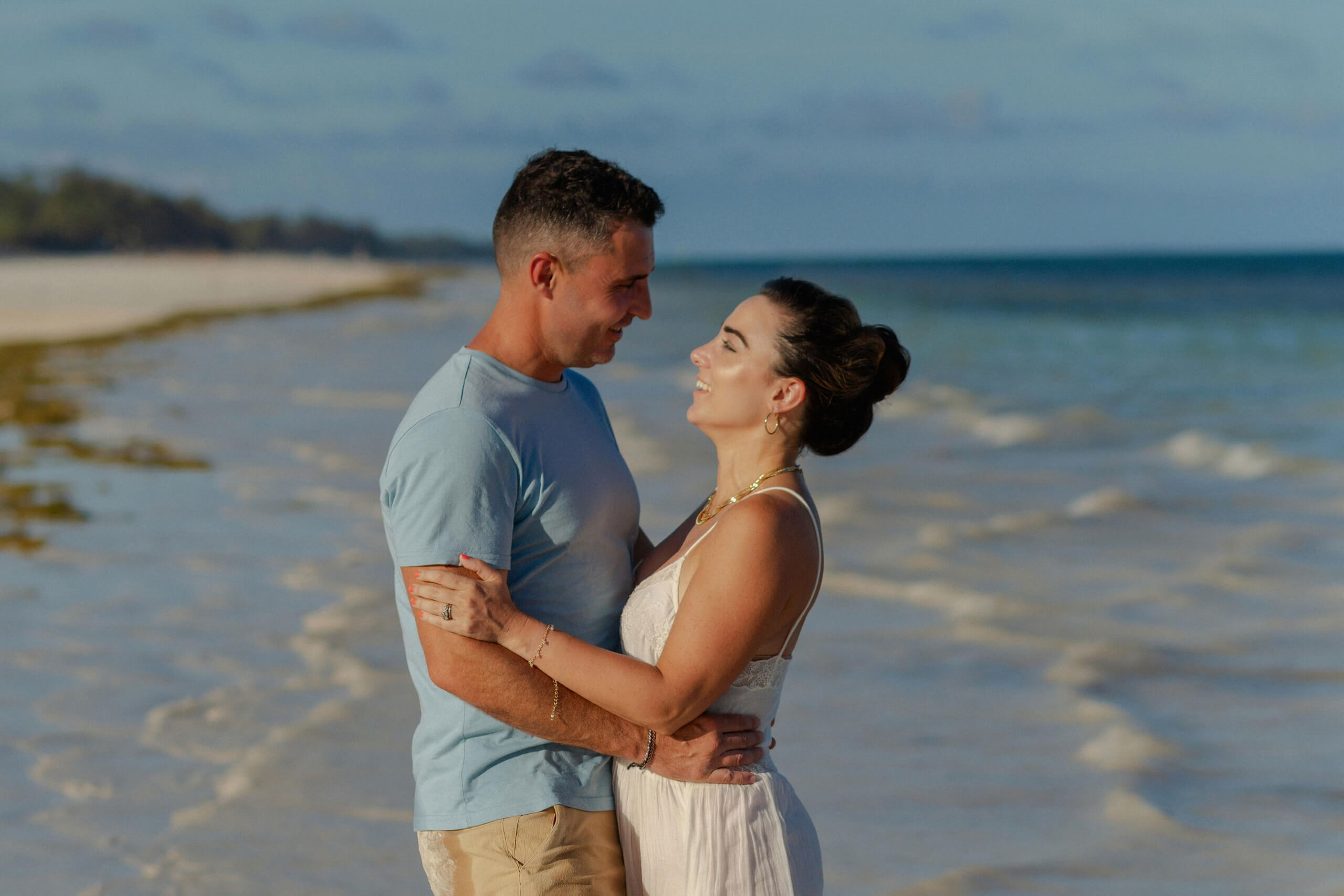 Seaside Kenya couple portrait session, laughing together, Diani Beach.