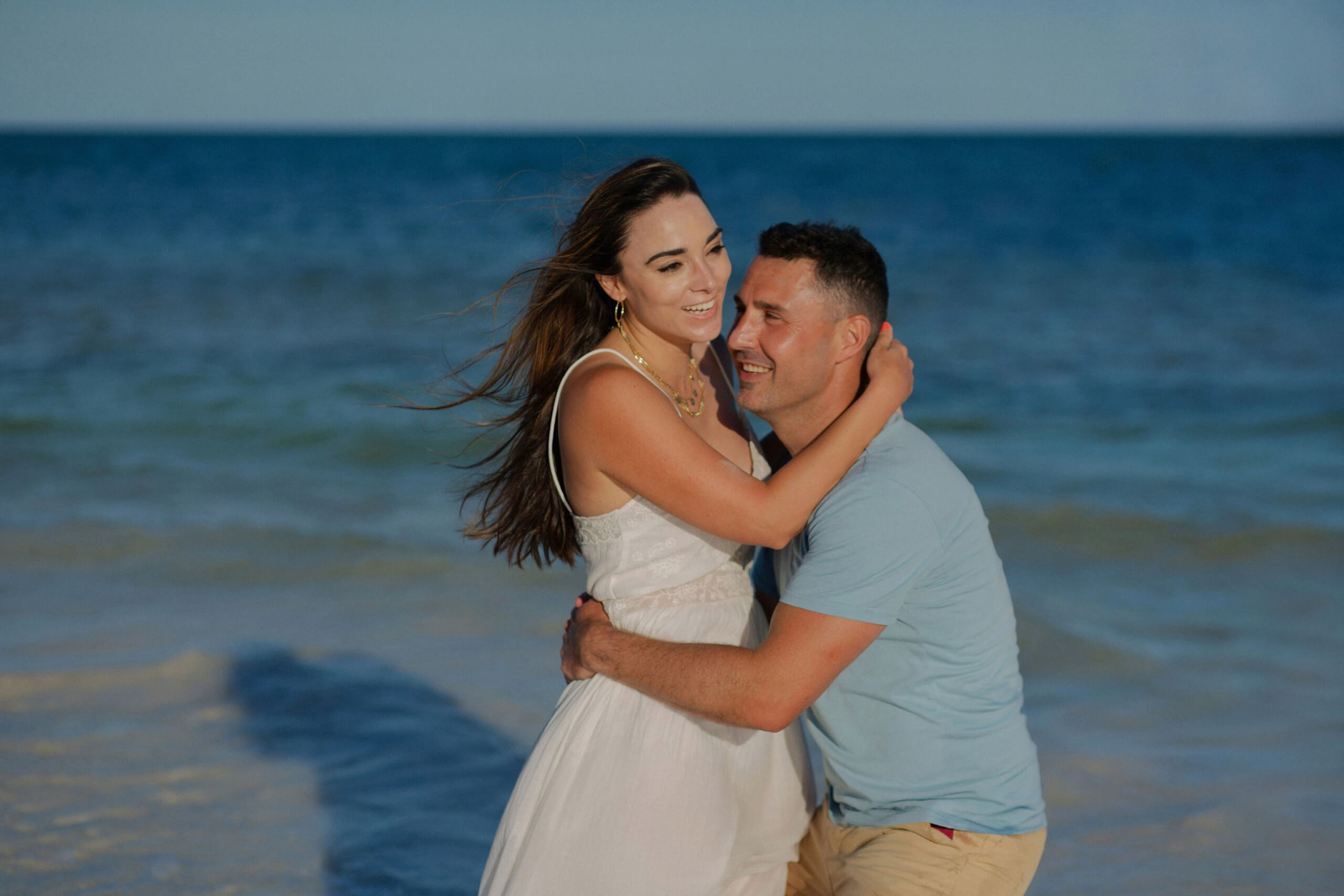 Anniversary couple at sunset shore, Diani Beach, Kenya romantic moment.