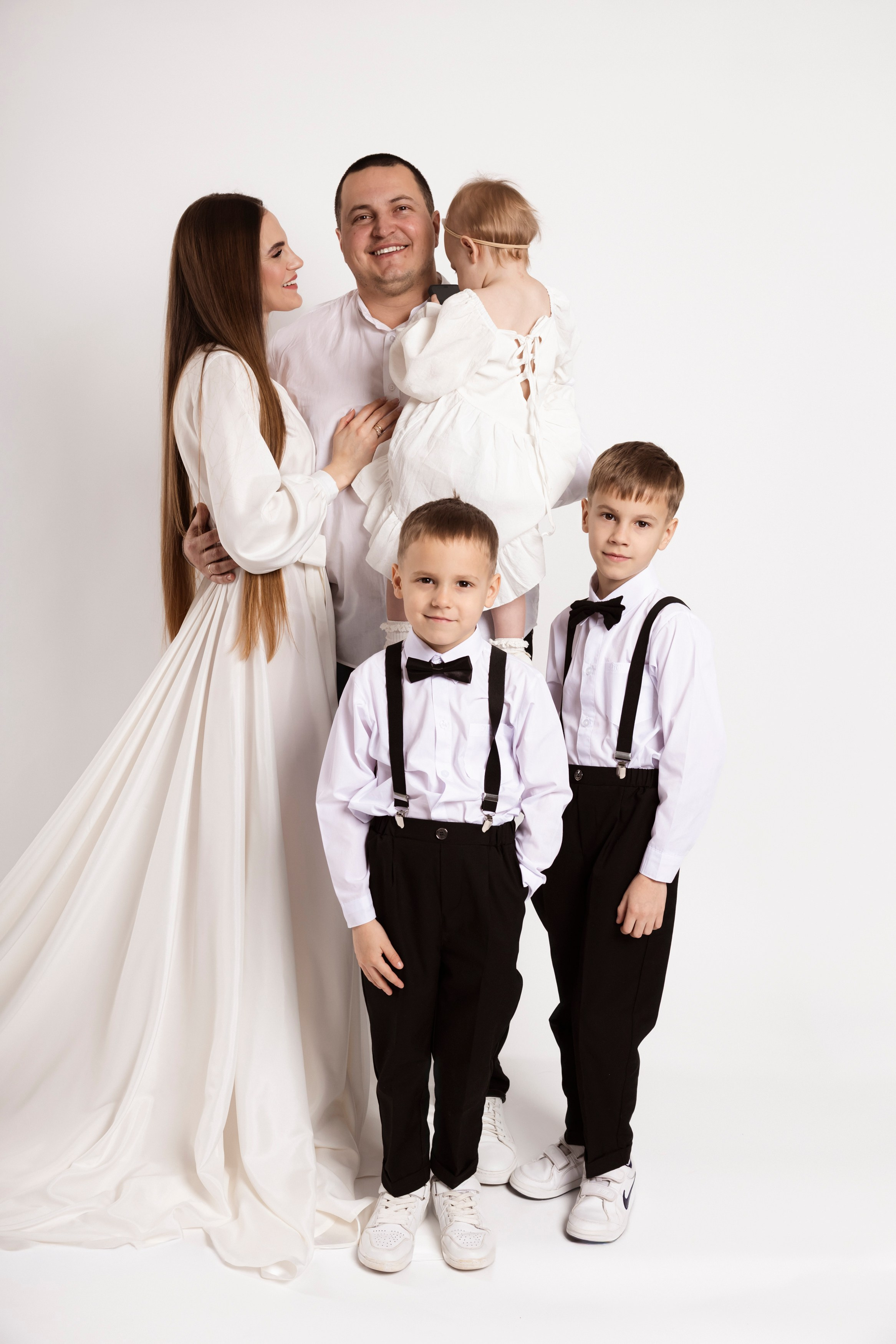 Preschool girl photoshoot with a cute rabbit by the lake in summer