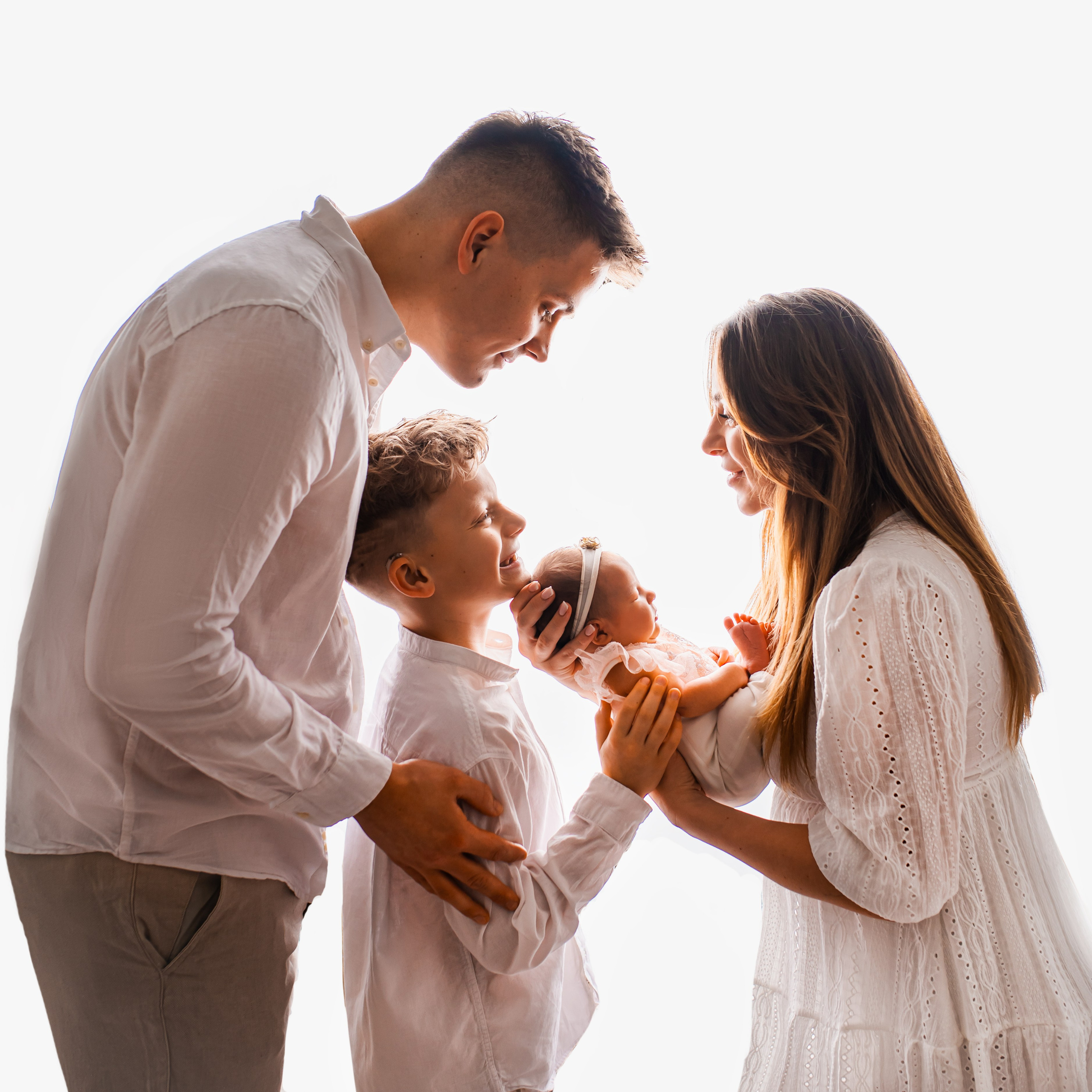 Family portrait with newborn baby during a studio photography session in Prague