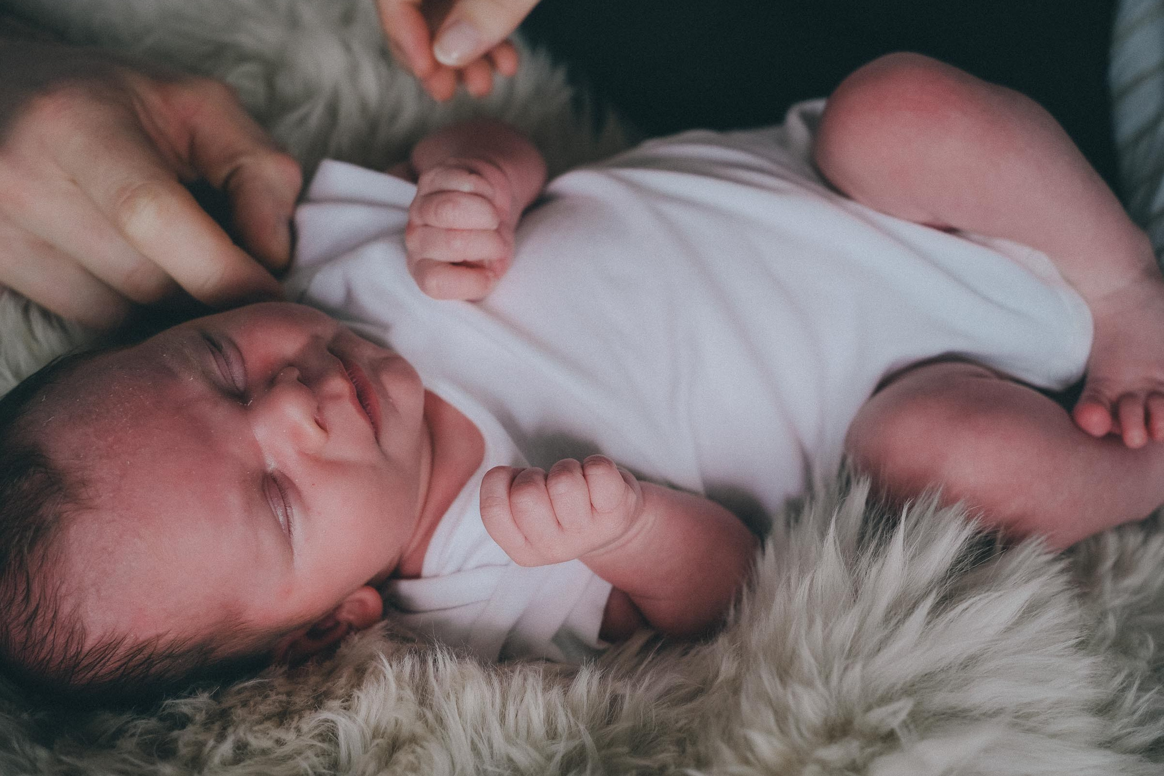 Newborn photography session with mother and baby by newborn photographer in Solihull