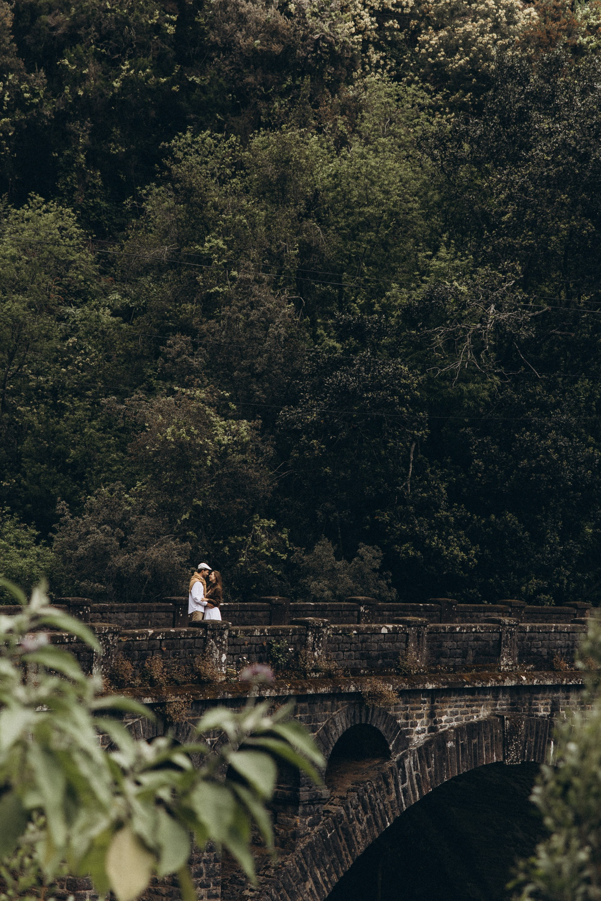 Cinematic couple photography in Madeira with golden light and dramatic coastal scenery.