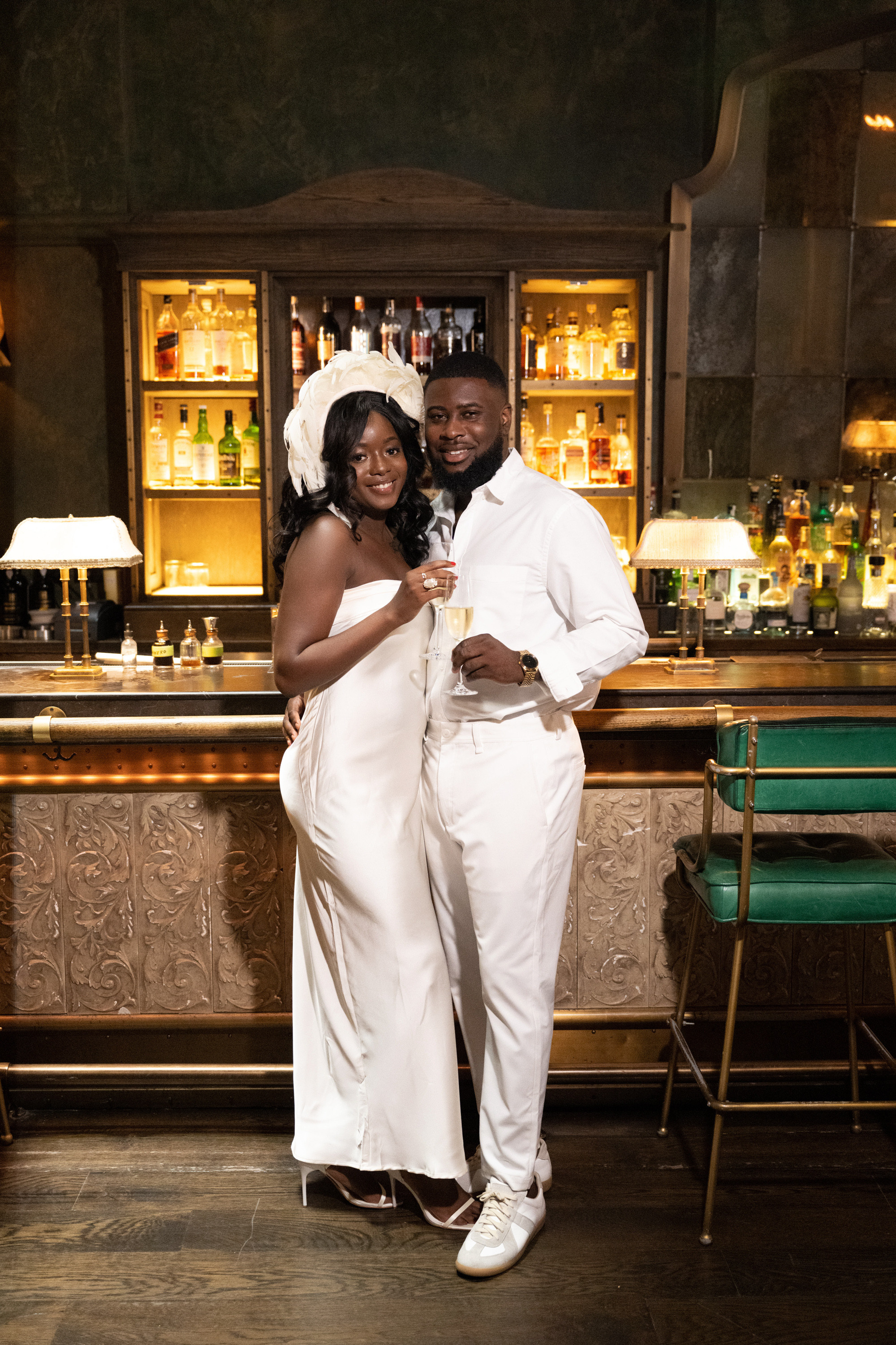 a man and woman standing in a bar