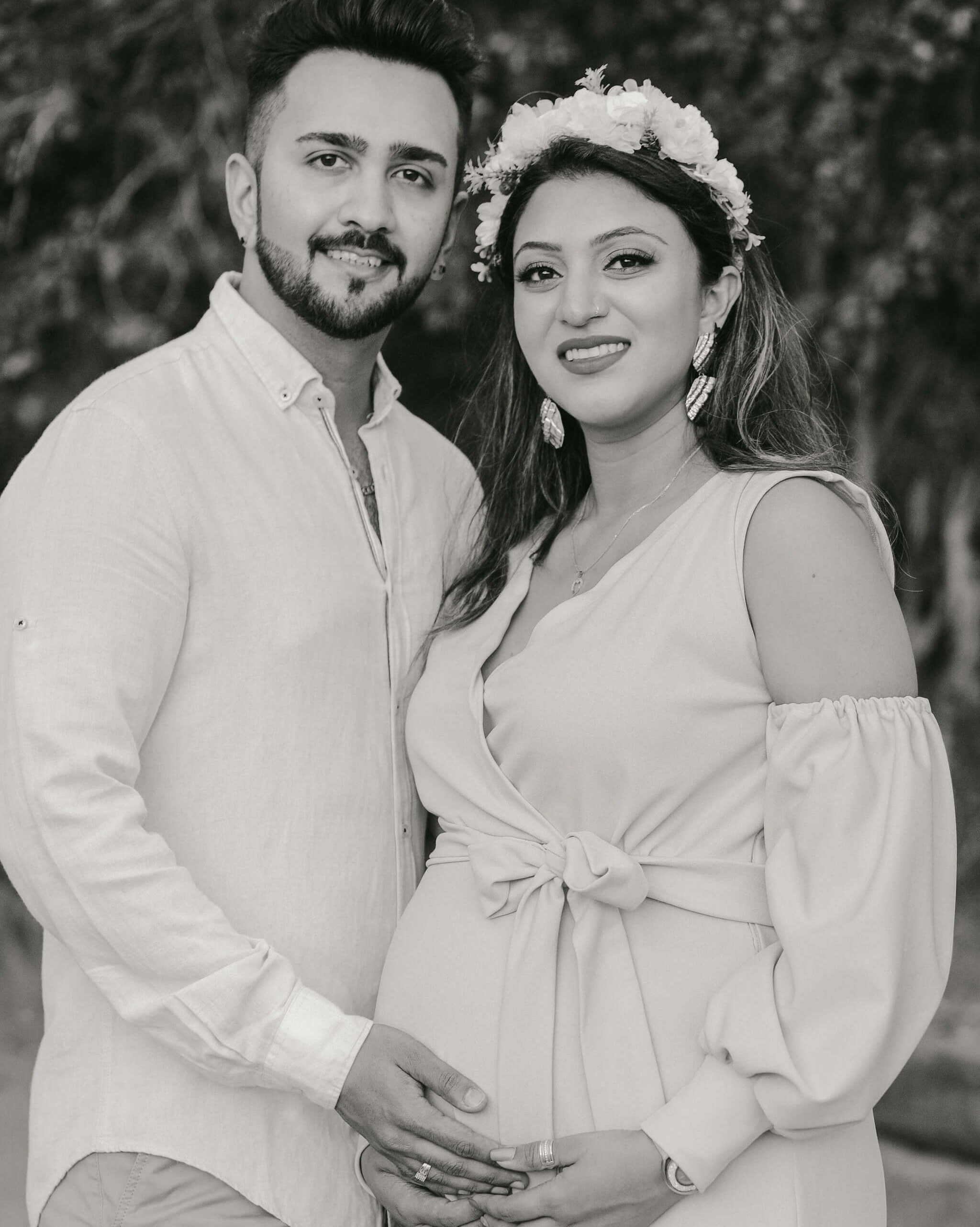 Vintage Kenya maternity couple photo walking on open path — timeless black and white aesthetic.