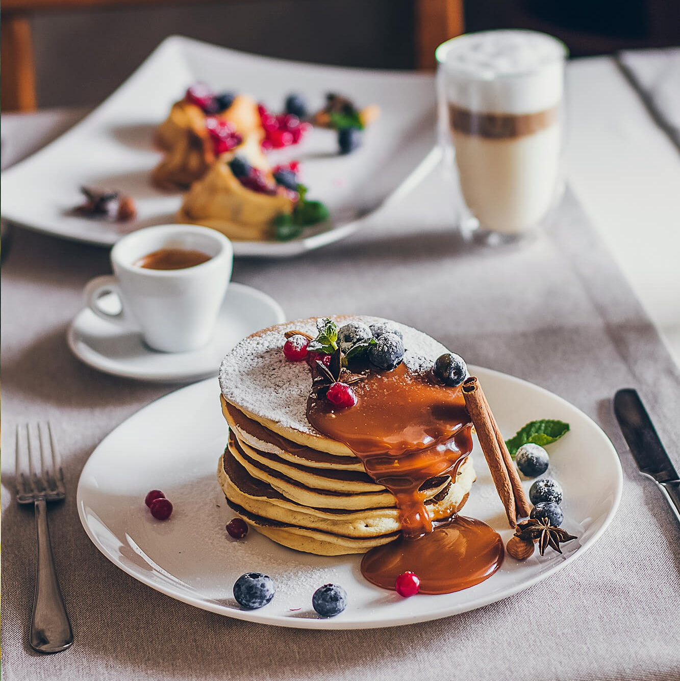 Authentic woodfired pizza photography in Melbourne, showcasing bubbling cheese and fresh basil toppings.
