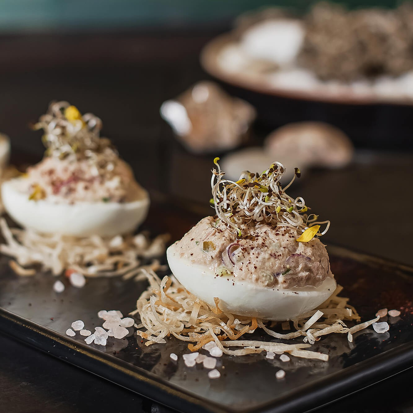 Cafe photography in Melbourne featuring a barista pouring intricate latte art in a specialty coffee shop.