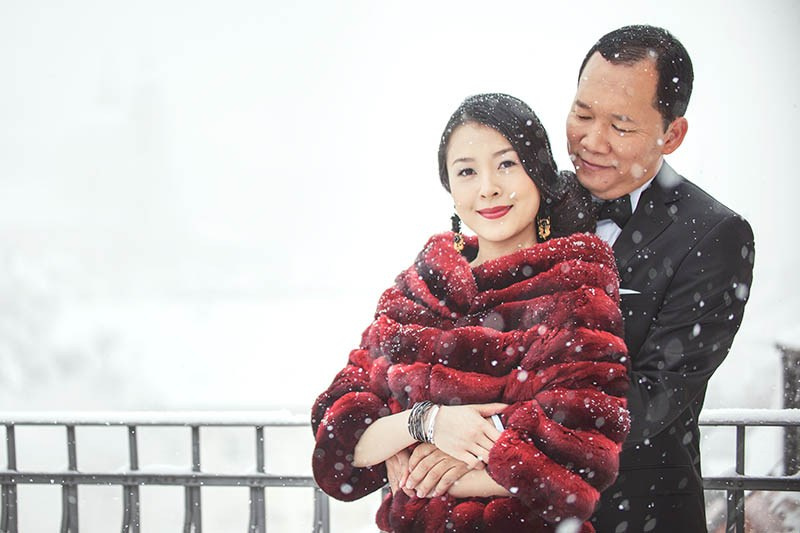 Helen and CY embrace on the Mandarin Oriental Presidential Suite terrace during their winter Prague pre-wedding.
