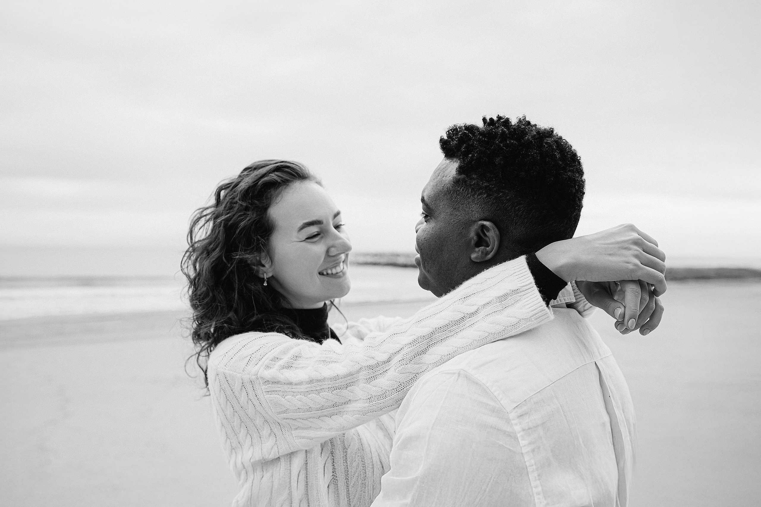 Black-and-white portrait of a couple embracing during a destination wedding photoshoot in Alicante, Spain