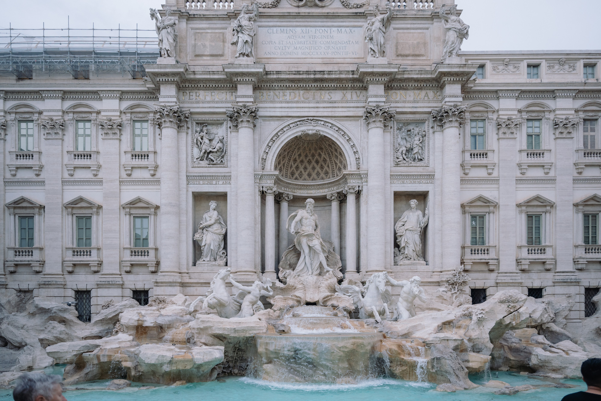 A cinematic elopement in Rome at sunrise, with quiet cobblestone streets, a vintage Vespa, and the Trevi Fountain in the rain