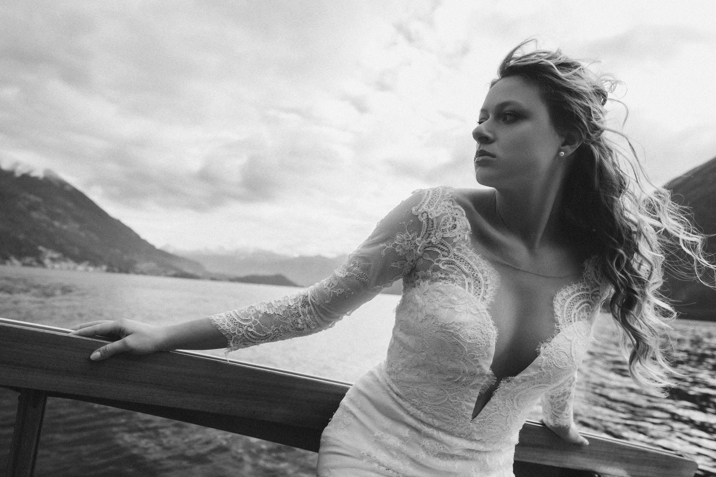 Romantic bride on boat with veil at Lake Como wedding in Italy