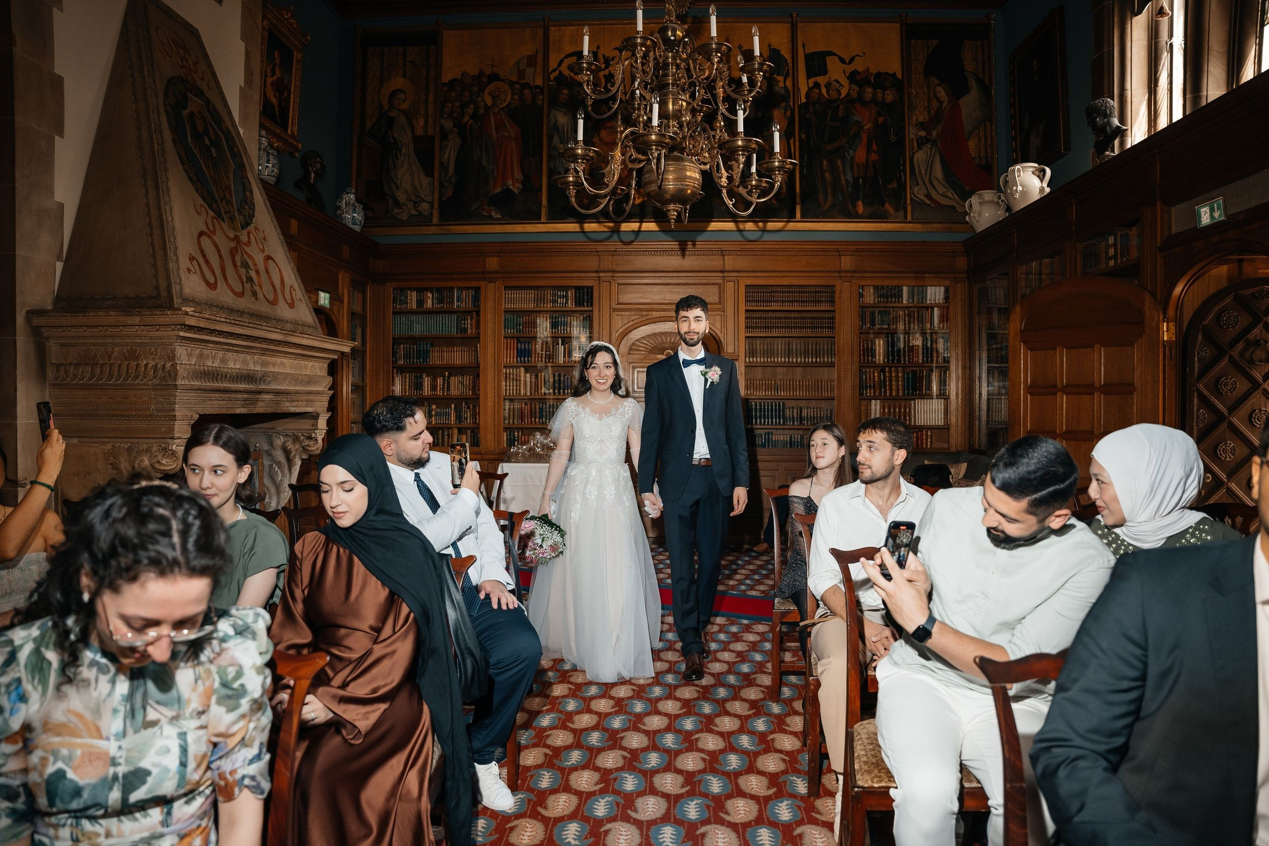 Bride and groom coming into library