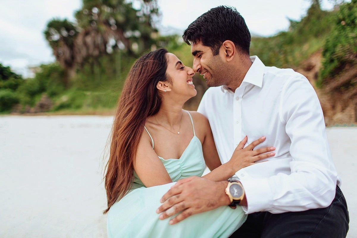 Couple shares a loving kiss by serene waters in Vipingo, Kenya. Capturing pure love and honeymoon magic with Maiafreia Studio — your Kenyan wedding and couple photography expert.