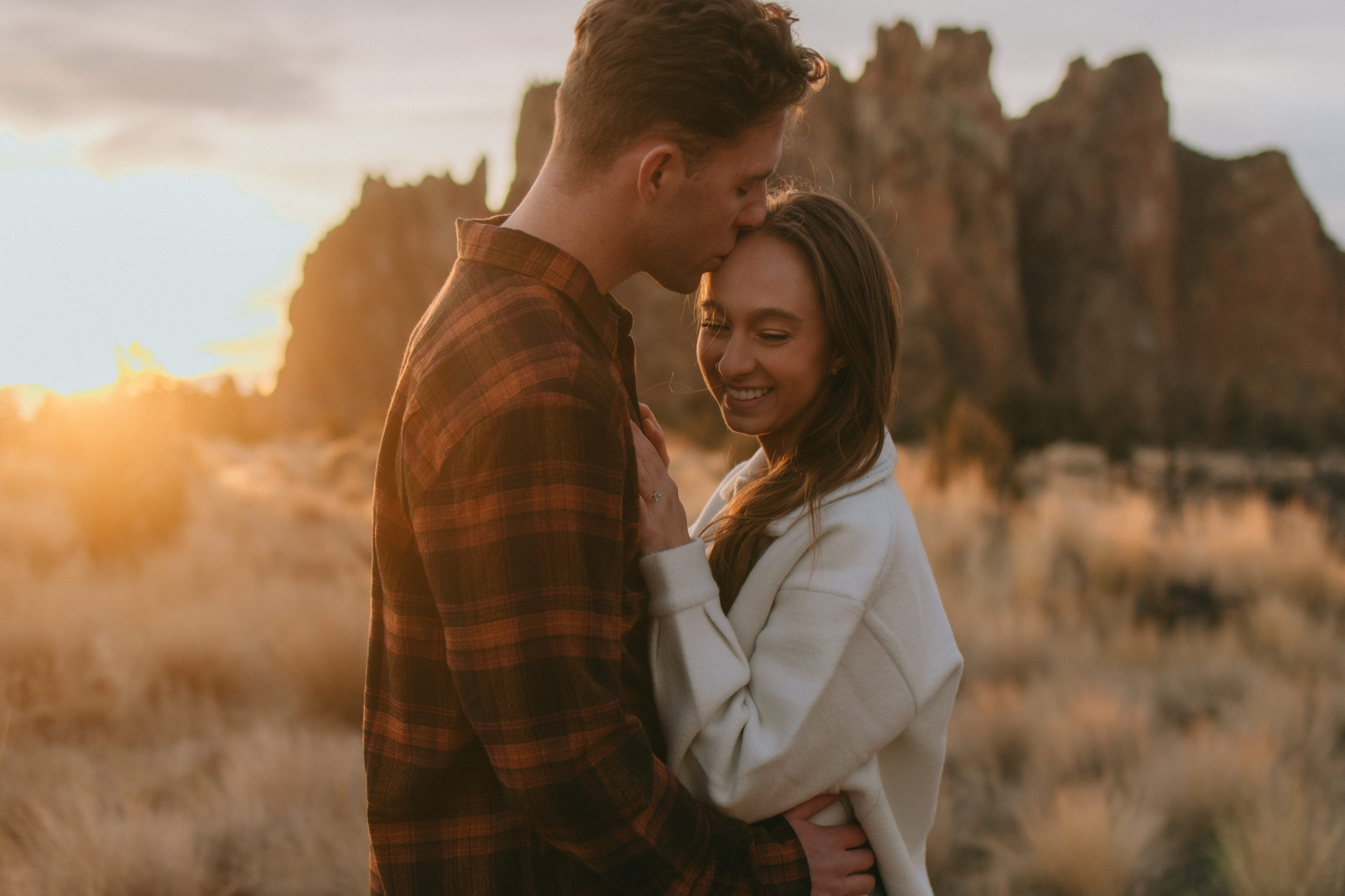 Sunset engagement photos at Smith Rock Oregon with majestic desert views
