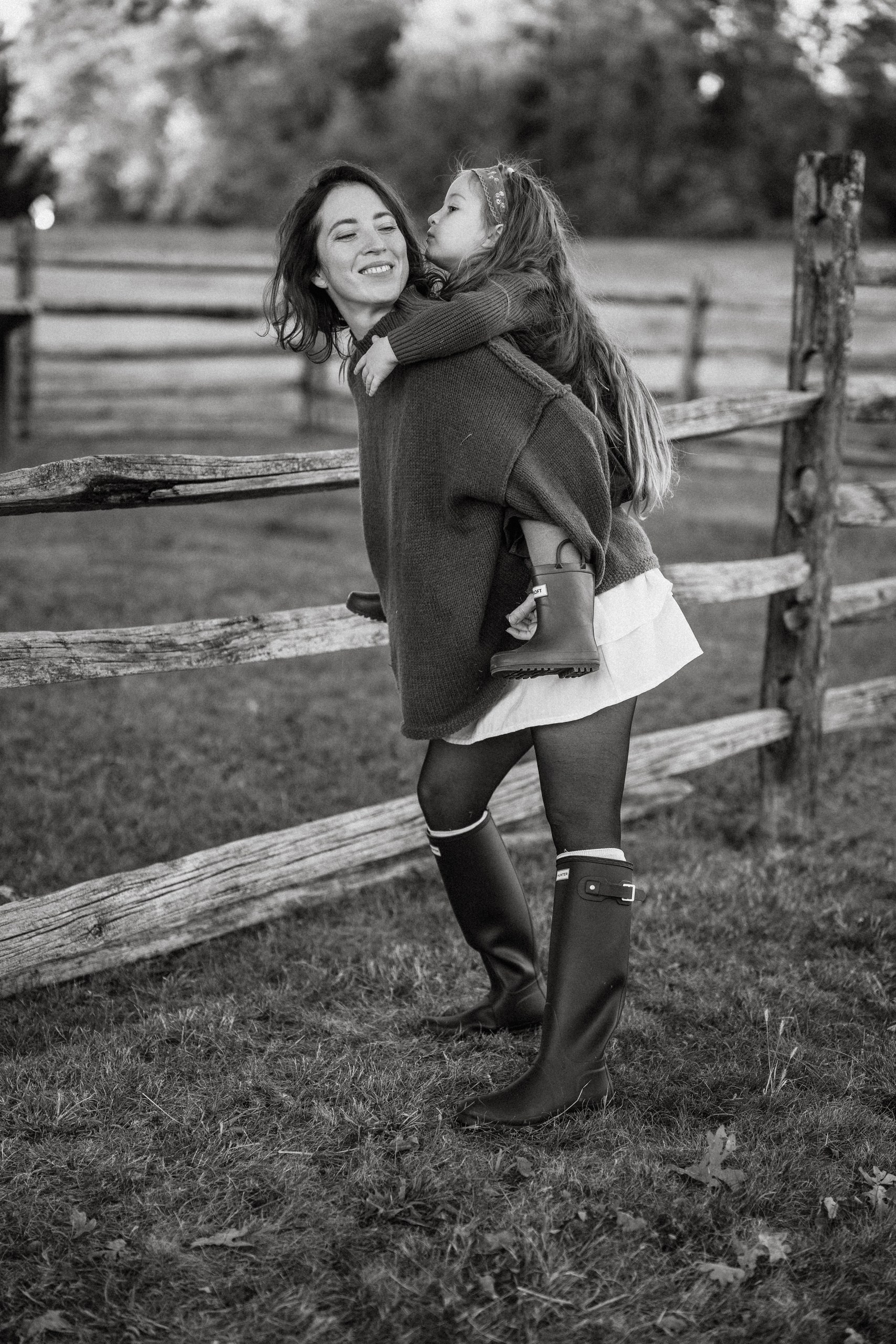 Authentic family moment photographed outdoors by Alisa Tant in Bucks County, Pennsylvania.