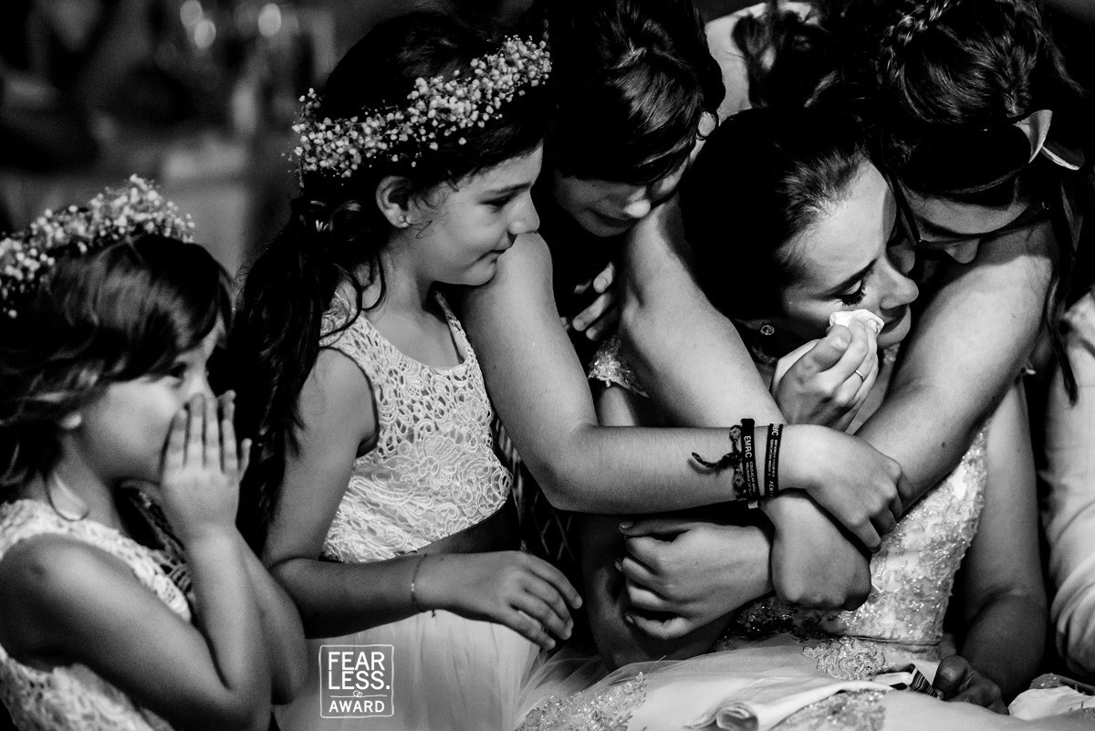 Emotional wedding embrace — Fearless Award-winning documentary photograph