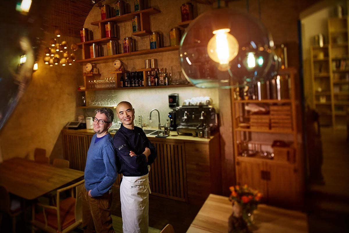 The owners of Mist Temple Vegan Restaurant pose for a portrait inside their newly opened restaurant in Prague's trendy Vinohrady neighborhood.