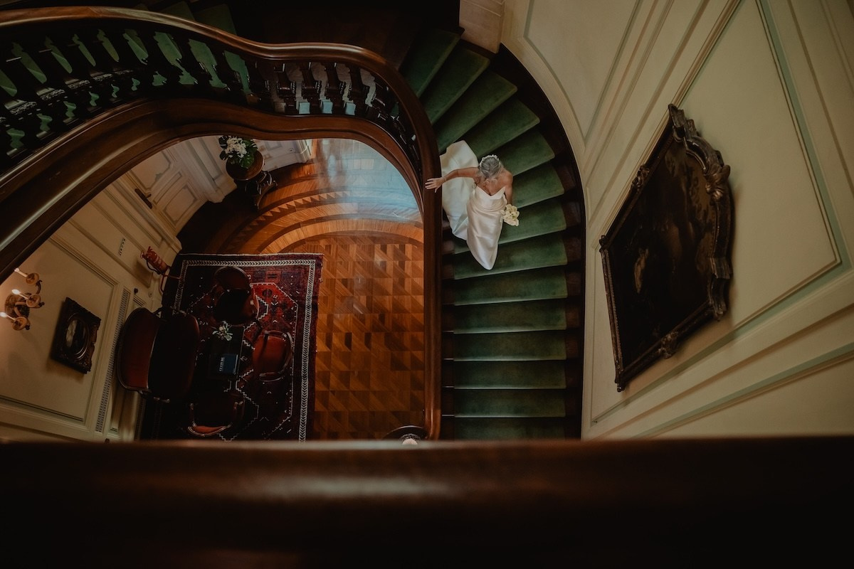 Bride photographed in dramatic natural light during an elegant destination wedding in Portugal