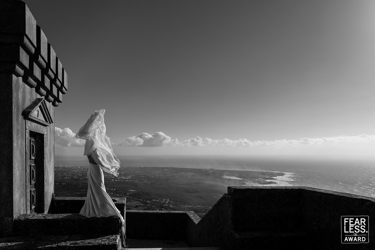 Bride overlooking the Atlantic coast — Fearless Award-winning wedding photograph by Nuno Lopes
