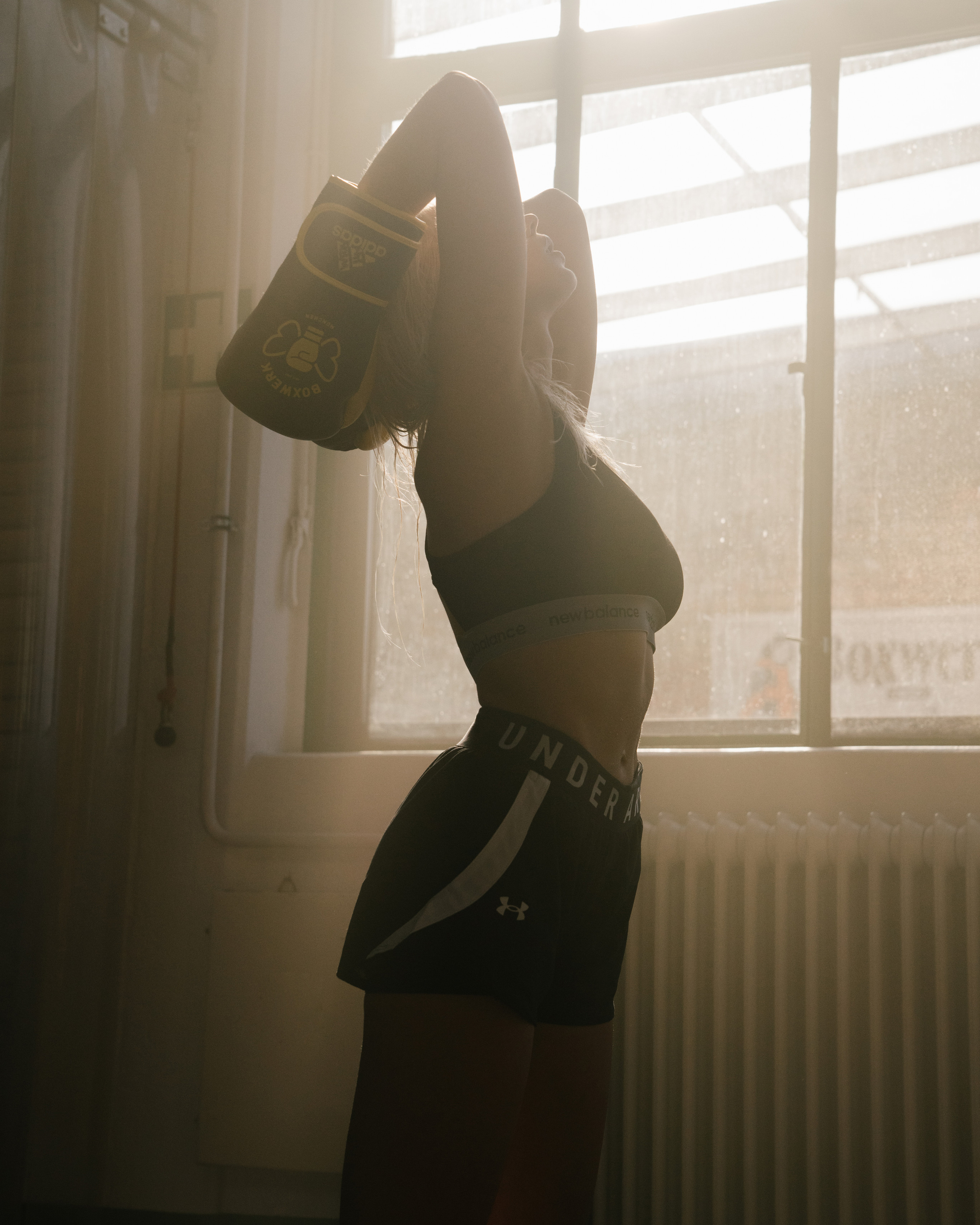 Boxing woman in a beautiful light