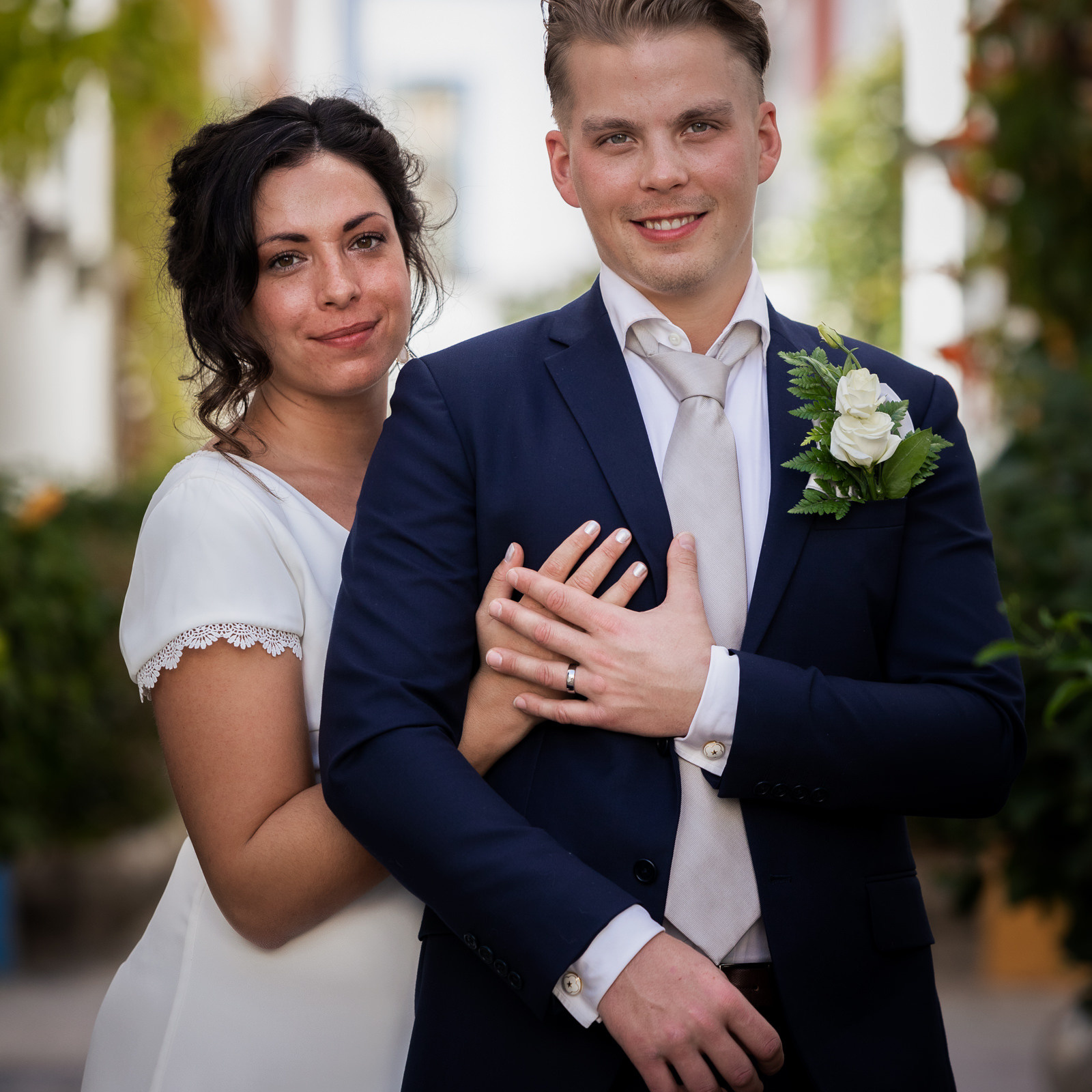 Photographer Love Story Gran Canaria A bride and groom are posing for a wedding photo.