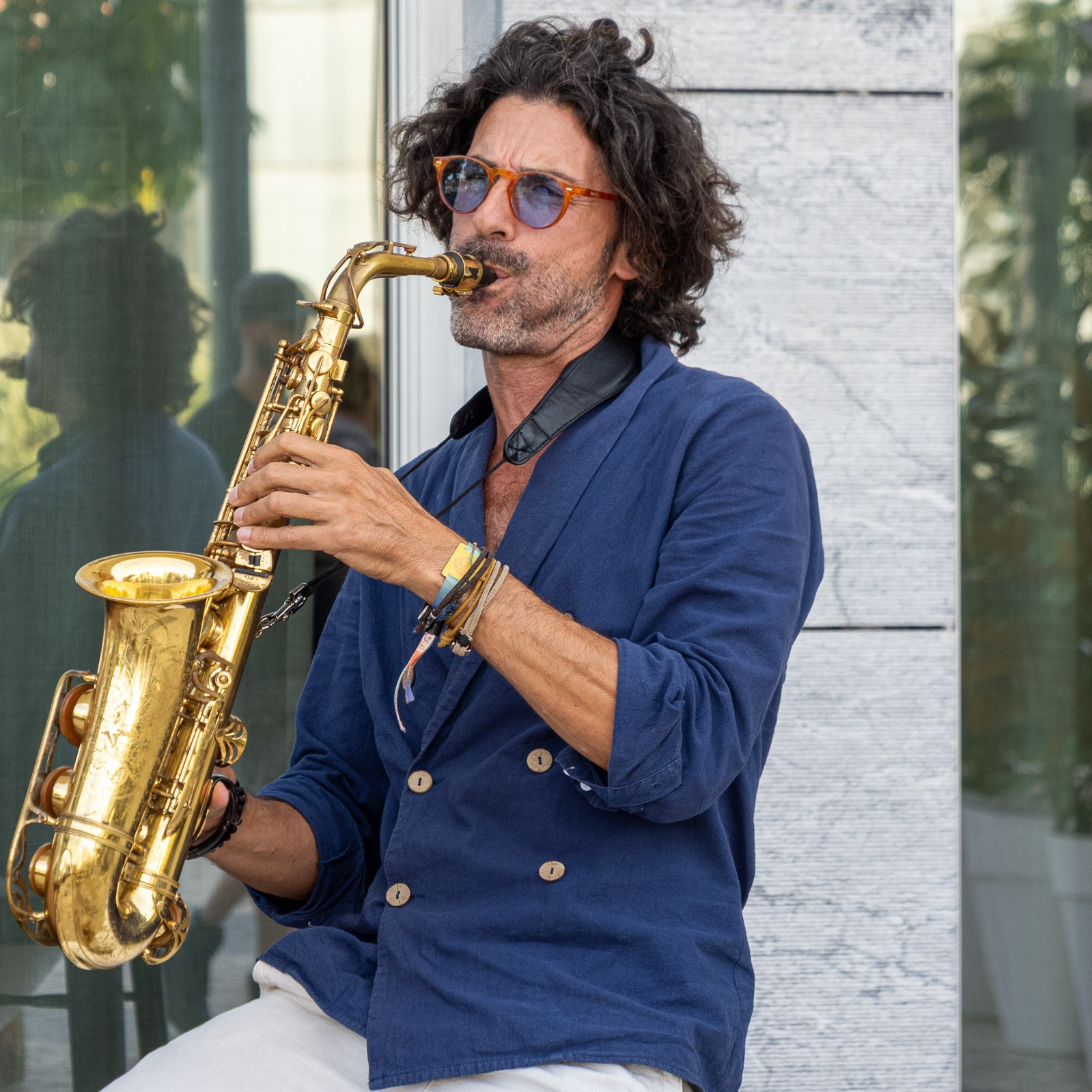 A saxophone player, playing at the Overtime Lisbon event. 