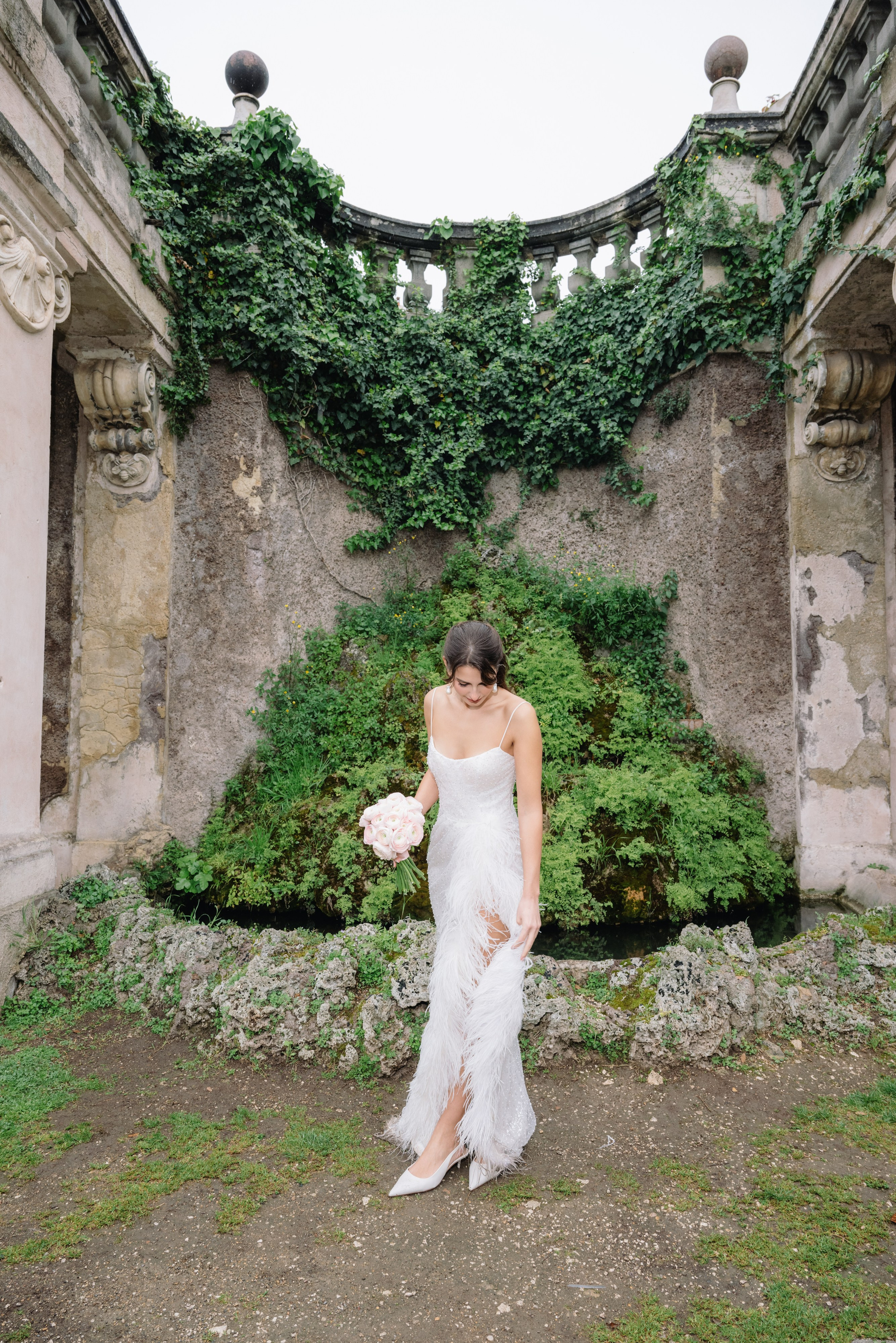A cinematic elopement in Rome at sunrise, with quiet cobblestone streets, a vintage Vespa, and the Trevi Fountain in the rain