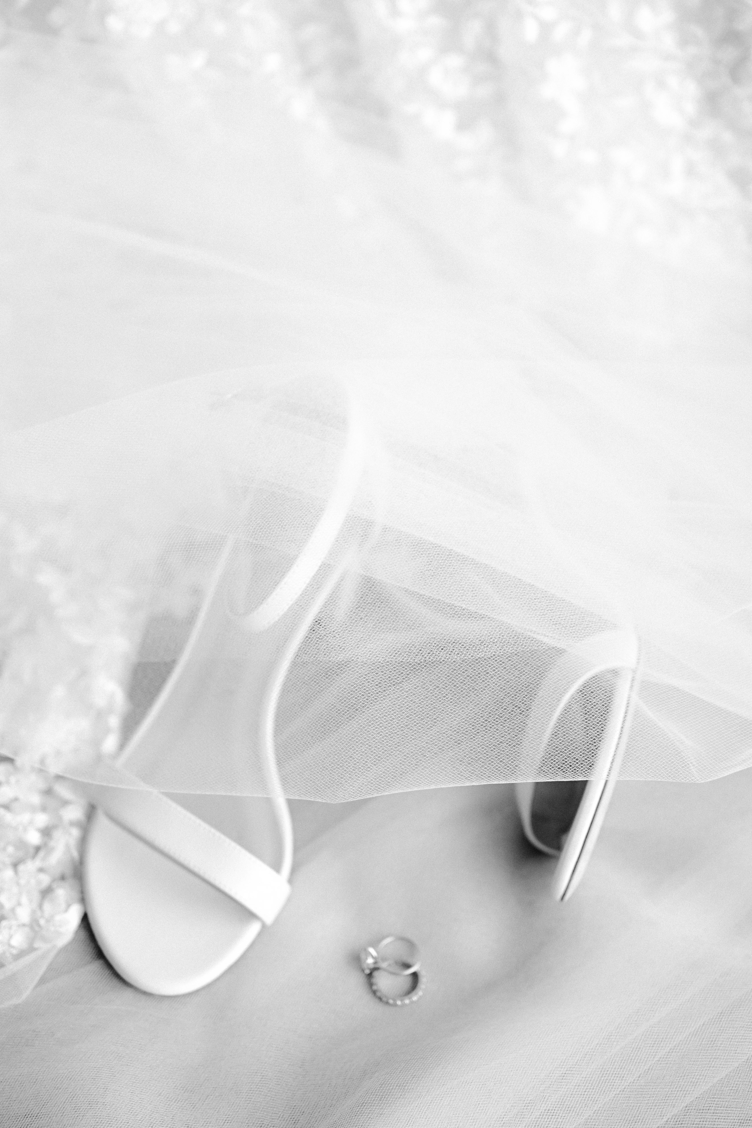 a pair of white shoes on a white background