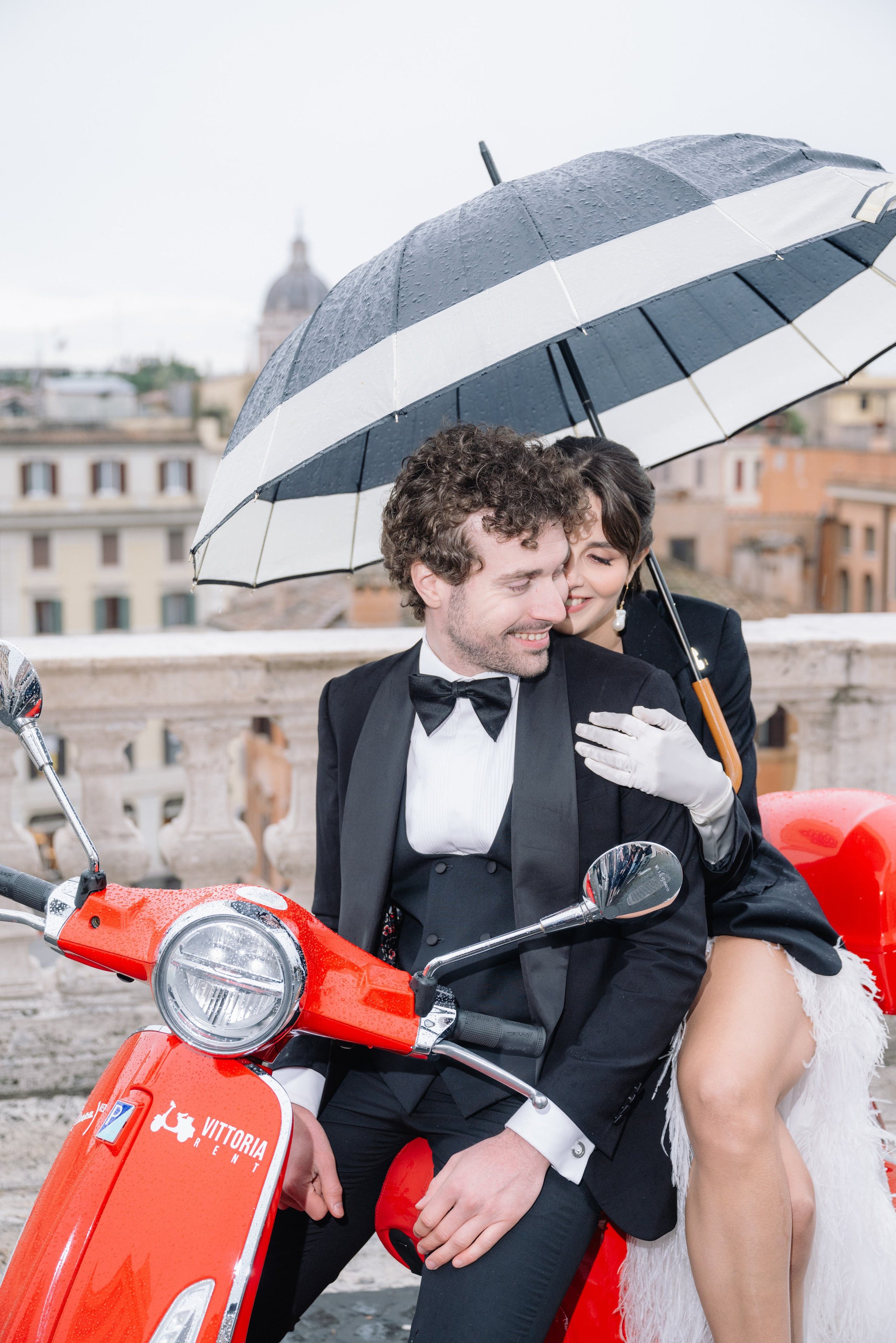 A cinematic elopement in Rome at sunrise, with quiet cobblestone streets, a vintage Vespa, and the Trevi Fountain in the rain