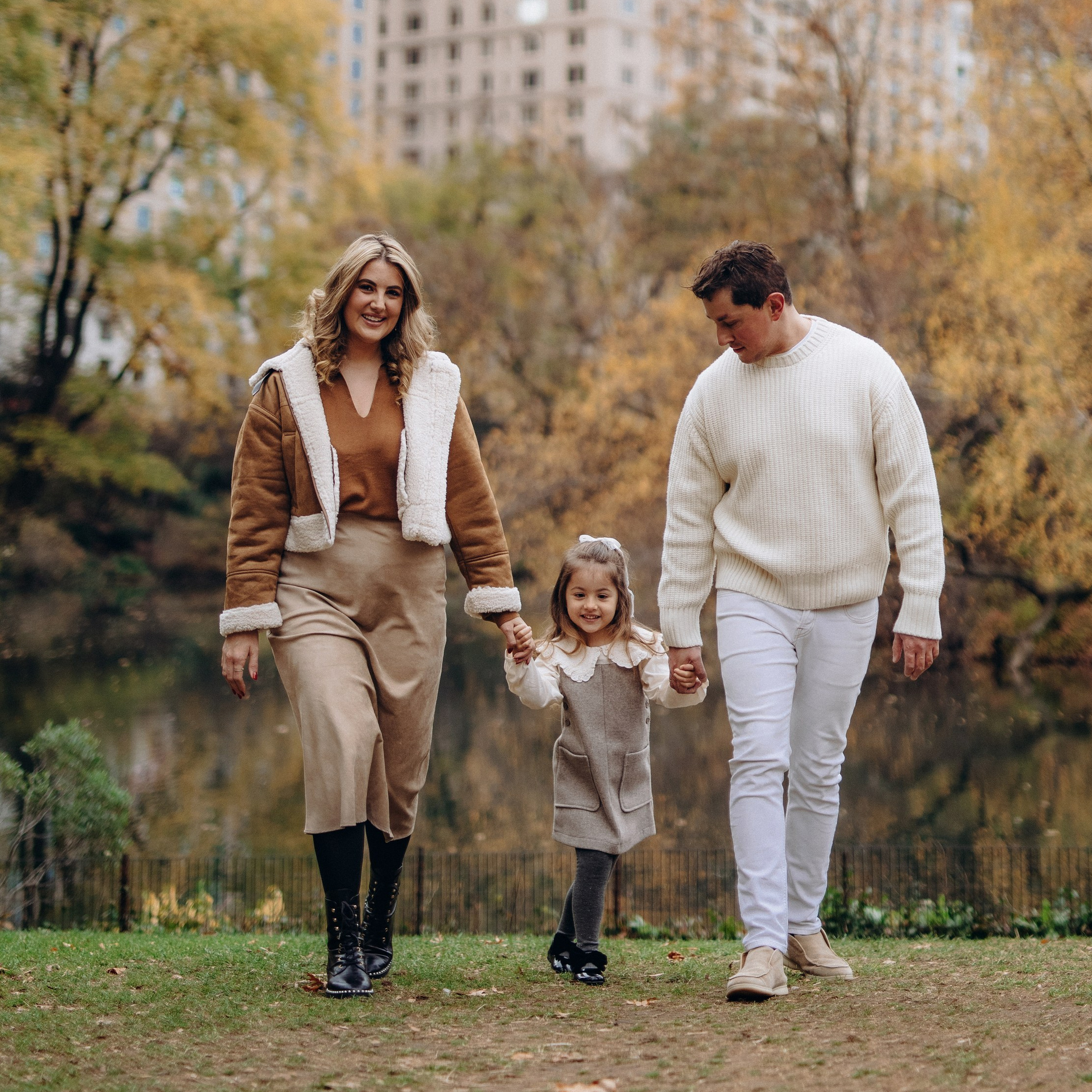 Family hugging near Bethesda Terrace in Central Park — cinematic New York photography