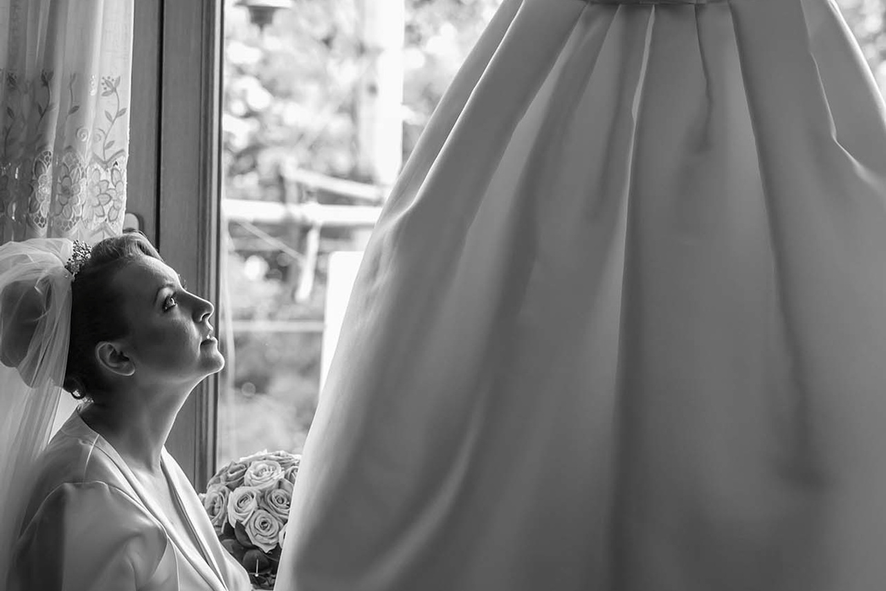 Wedding photographer Epoque Hotel, Bucharest Romania Bride looking at her dress Nikon D850