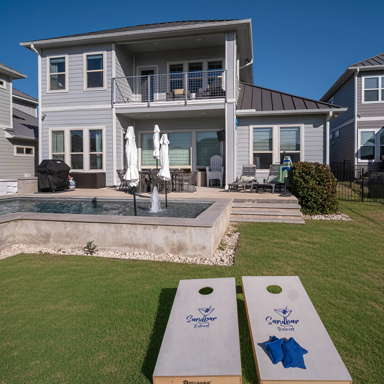 Modern two-story house with backyard pool photographed by Austin real estate photographer