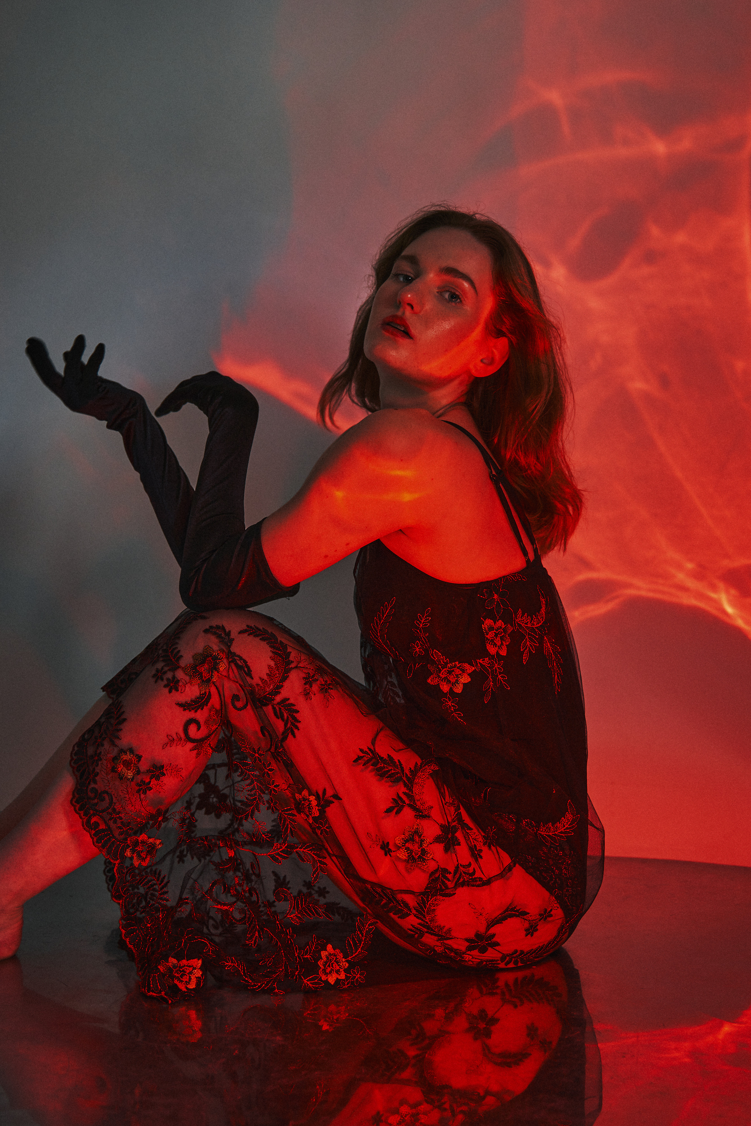 a female model with red studio light