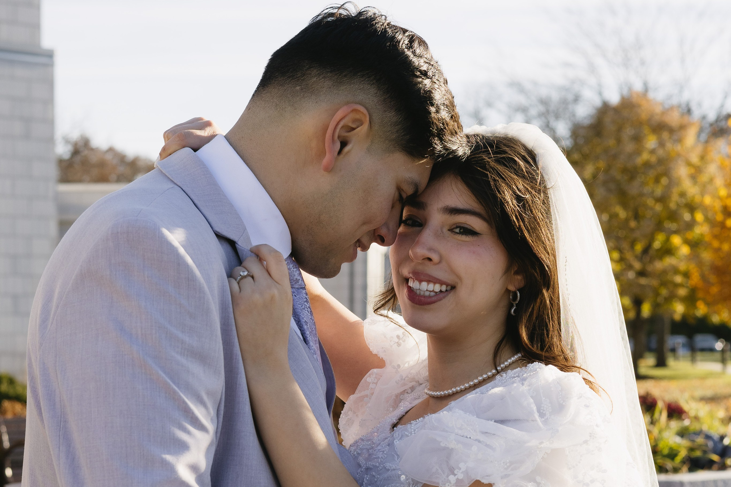 Wedding couple embracing in a Chicago park during daylight
