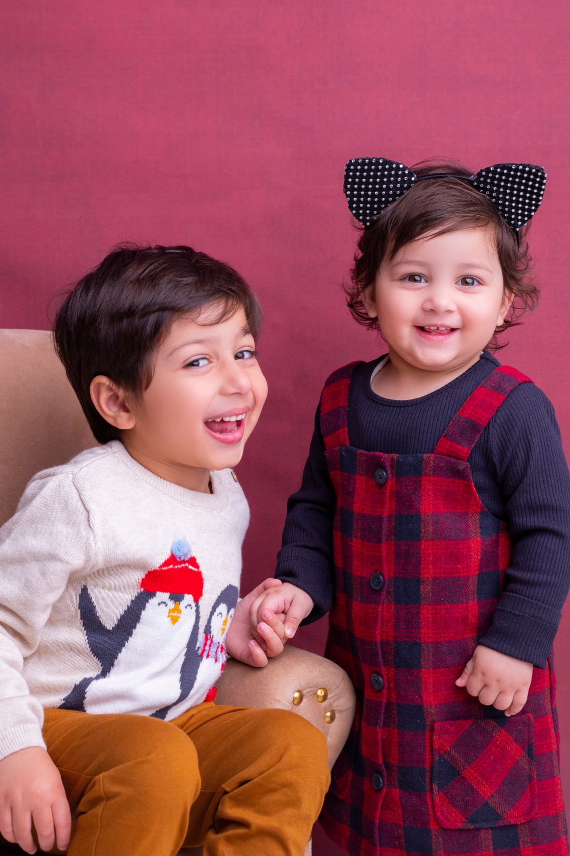 Two little kids/siblings laughing together having a professional photoshoot done. baby photography. peshawar. faryal's baby photography. baby pictures. newborn. newborn picture. newborn pictures. newborn photography.