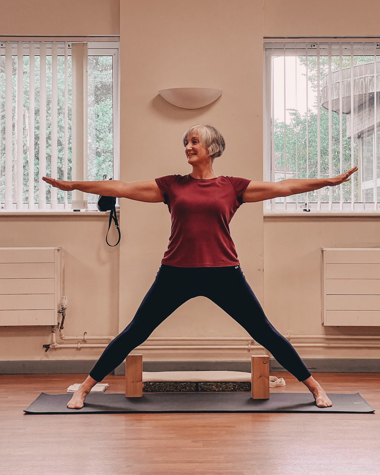 Clare Preston while teaching yoga lessons at Kings Heath. Woman in a yoga pose. Brand photography.