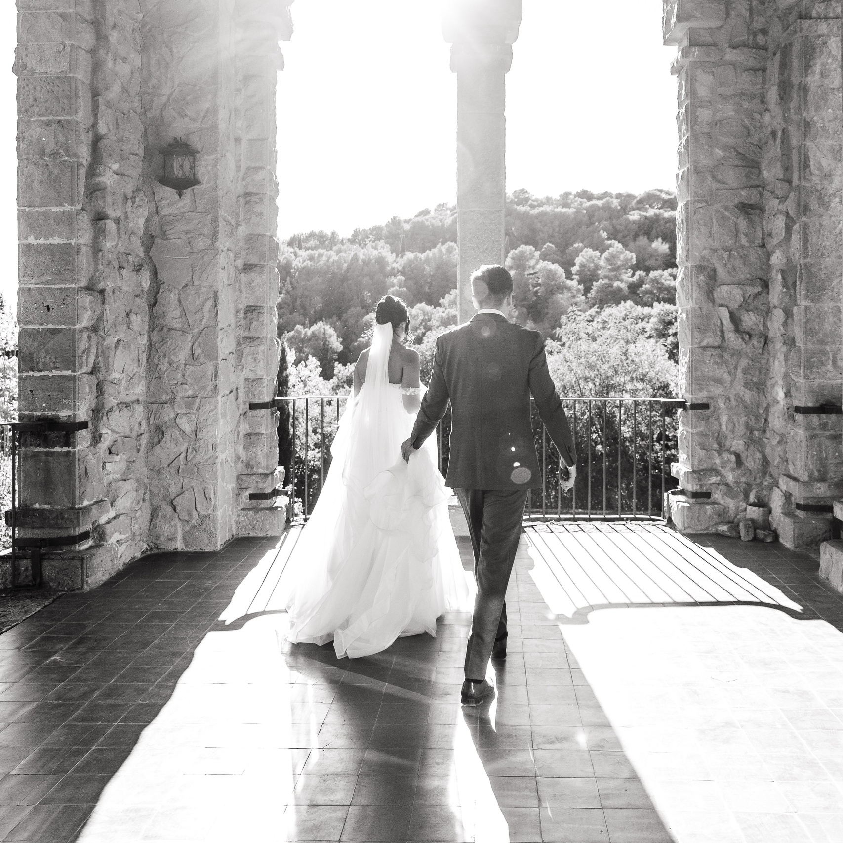 Bride and groom sharing a candid moment during the golden hour at La Baronia wedding venue