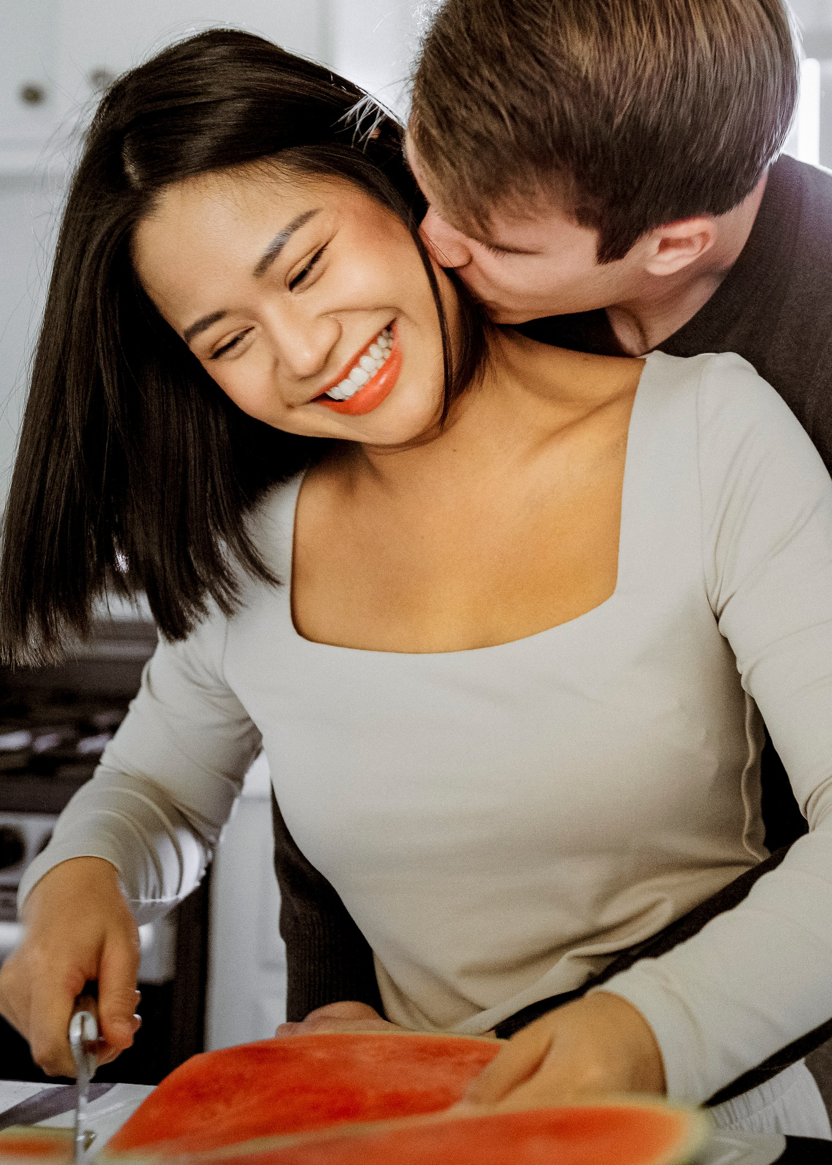 Couple cooking together during an in-home photoshoot in Orange County