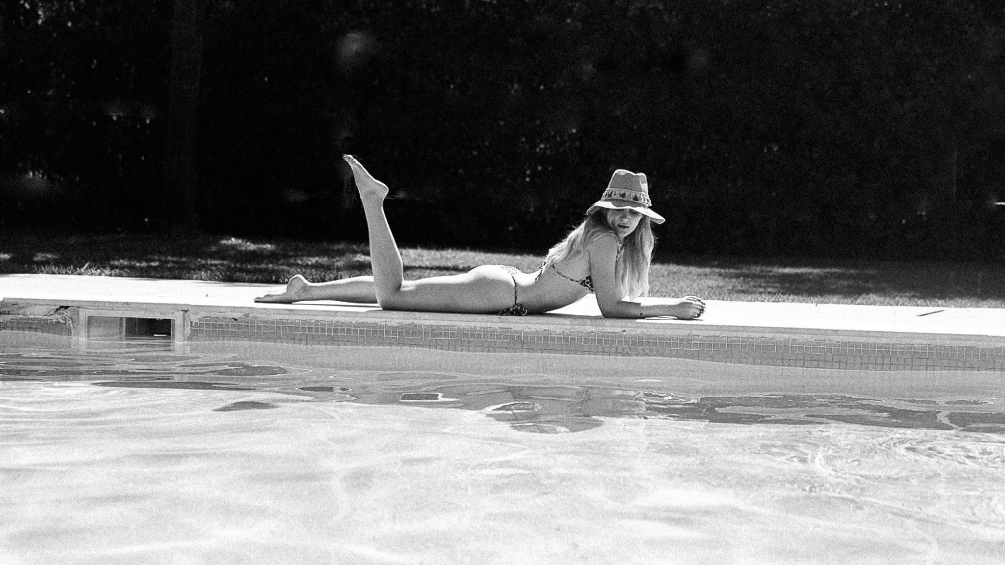 A woman relaxed by the swimming pool in Rome.