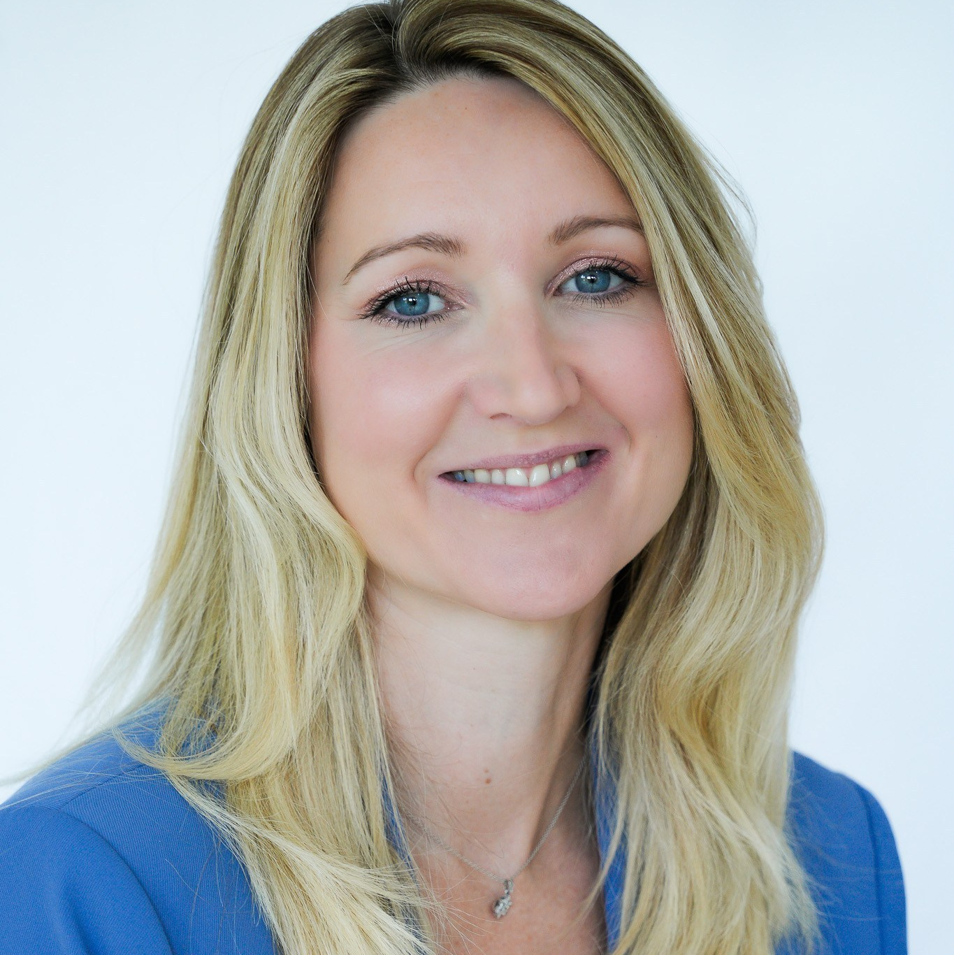 Professional headshot of blonde woman in Solihull studio, corporate portrait photography